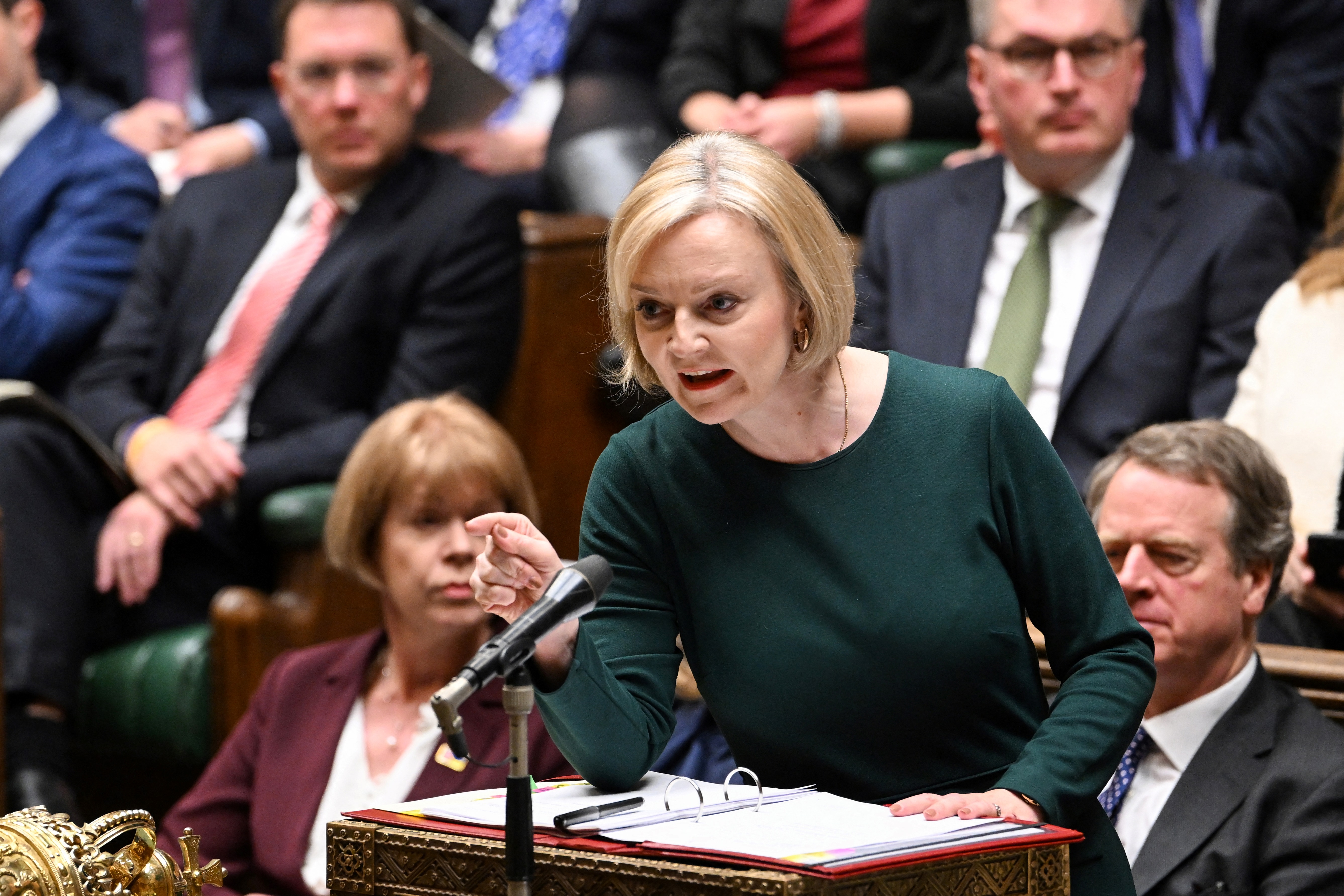 A handout photograph released by the UK Parliament shows Britain's Prime Minister Liz Truss gesturing and speaking during the Prime Minister's Questions (PMQ's) at the House of Commons, in London, on October 12, 2022. (Photo by JESSICA TAYLOR / UK PARLIAMENT / AFP) / RESTRICTED TO EDITORIAL USE - NO USE FOR ENTERTAINMENT, SATIRICAL, ADVERTISING PURPOSES - MANDATORY CREDIT " AFP PHOTO / Jessica Taylor /UK Parliament"