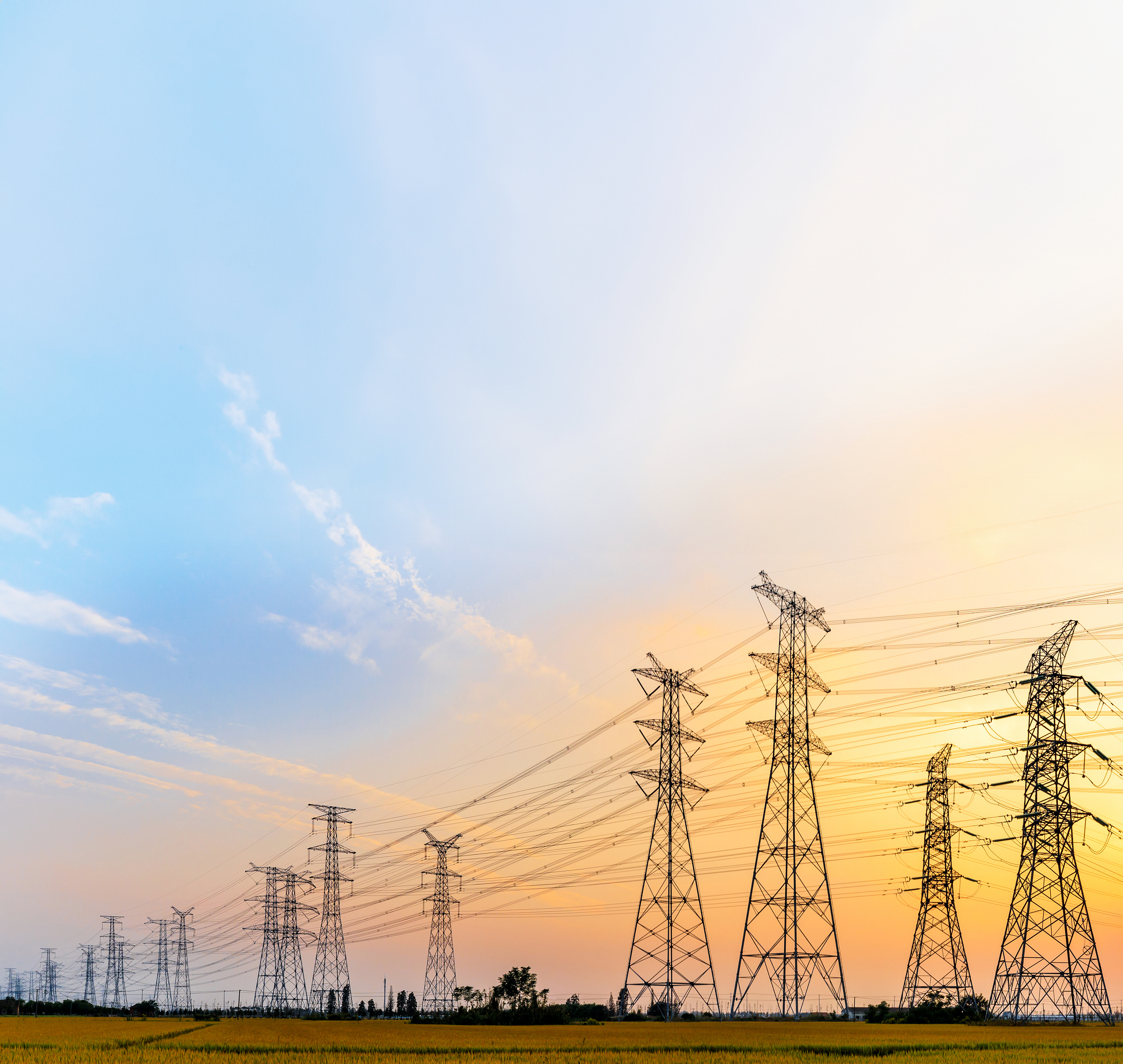 high-voltage power lines at sunset,high voltage electric transmission tower