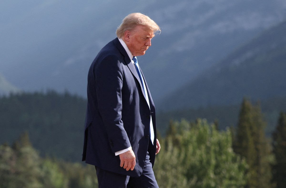 US President Donald Trump departs after a family photo during the Group of Seven (G7) Summit at the Kananaskis Country Golf Course in Kananaskis, Alberta, Canada on June 16, 2025. (Photo by Suzanne Plunkett / POOL / AFP)