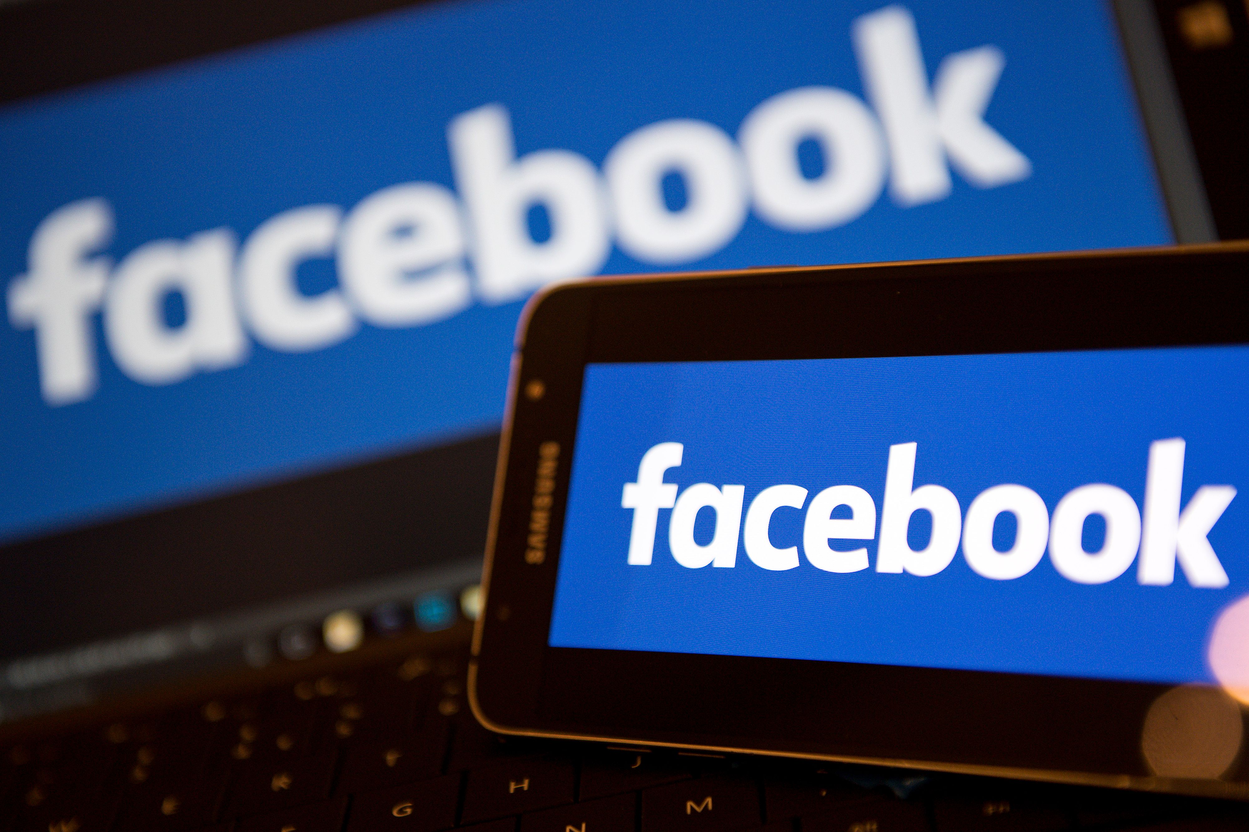 (FILES) In this file photo taken on November 21, 2016 Facebook logos are pictured on the screens of a smartphone (R), and a laptop computer, in central London on November 21, 2016.
Cambridge Analytica is a private company for strategic communication and data analysis at the heart of a scandal over the use of personal data collected on Facebook. A subsidiary of Strategic Communications Laboratories (SCL), Cambridge Analytica (CA) has offices in New York, Washington and London and is directed by Alexander Nix. / AFP PHOTO / Justin TALLIS