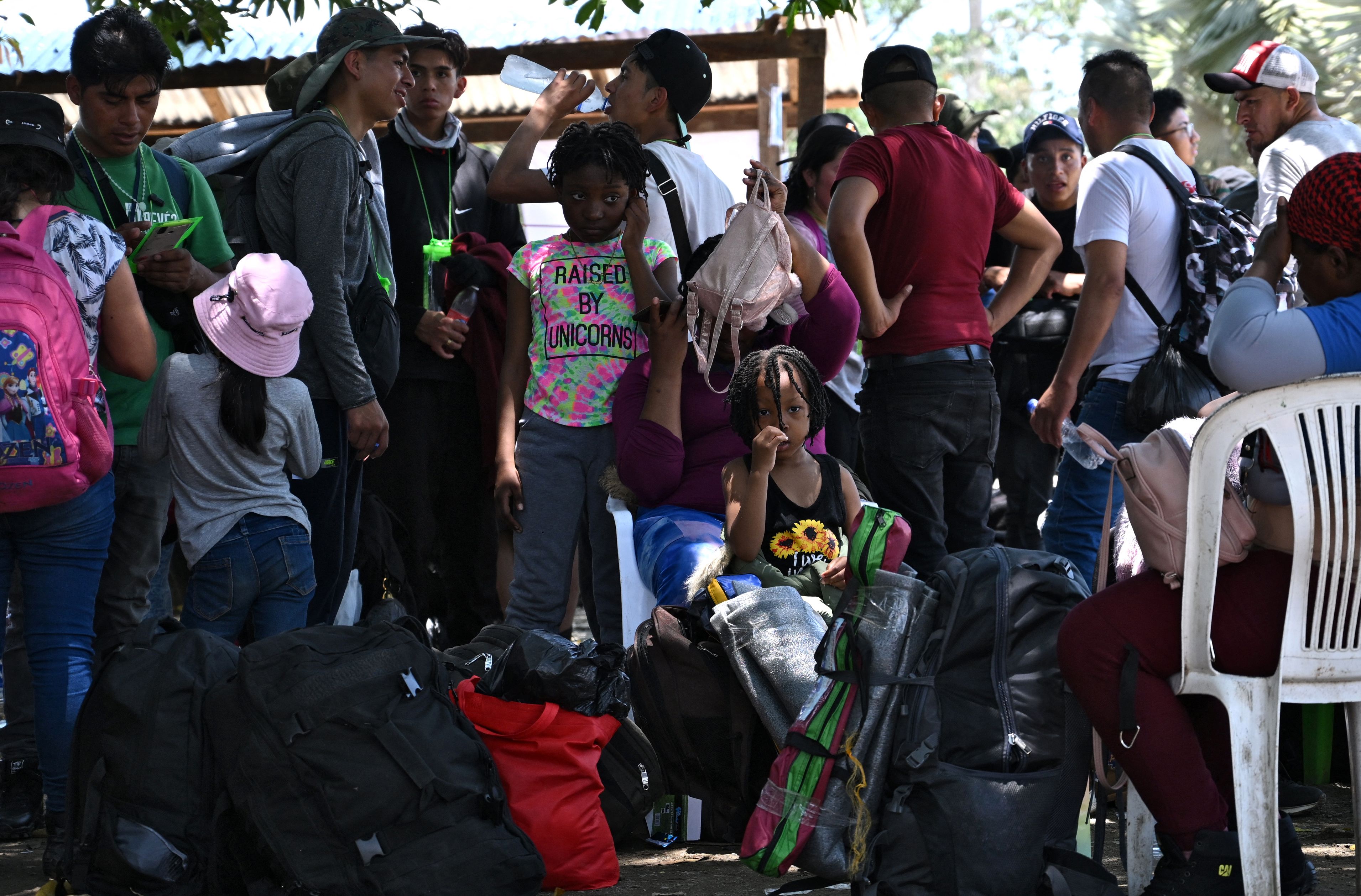 Migrants, mostly from Venezuela, remain in a shelter in Acandi, Colombia, close to the Darien Gap, a jungle shared by Colombia and Panama, before continuing their journey towards the United States in hope of a better life, on September 19, 2023. An impregnable jungle and the world's largest cocaine cartel are the terror of migrants in Colombia. The border with Panama is both a difficult dike to cross and an opportunity to make money at the expense of the American dream. South Americans, Africans and Asians make their way village by village to the Darien, a hellhole on a paradisiacal gulf that gives its name to Colombia's largest narco-trafficking gang: the Clan del Golfo, or Gulf Clan. Lord and master of this region located in the departments of Antioquia and Choc�. (Photo by Raul ARBOLEDA / AFP)