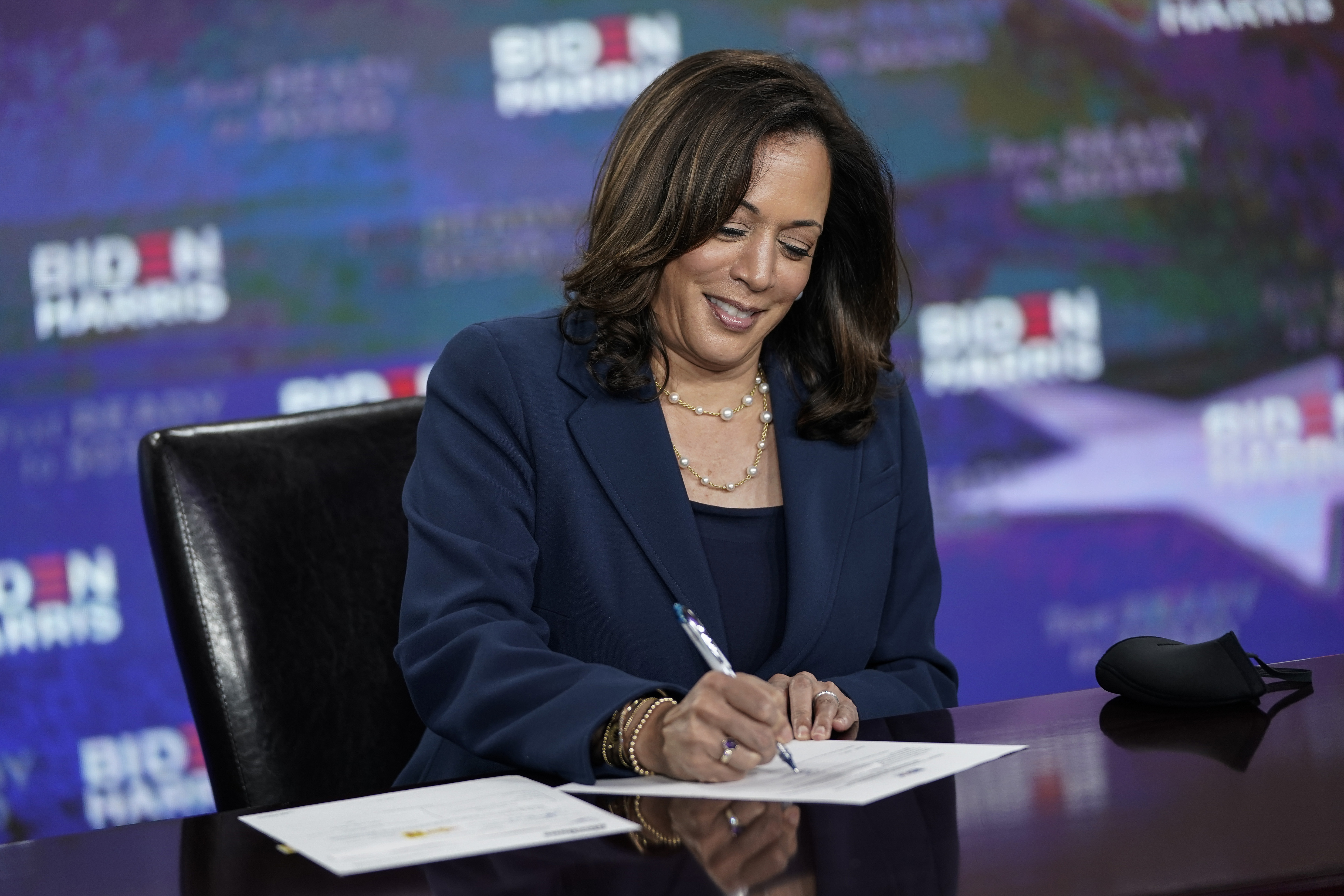 WILMINGTON, DE - AUGUST 14: Presumptive Democratic vice presidential nominee, U.S. Sen. Kamala Harris signs required documents for receiving the Democratic nomination for Vice President of the United States at the Hotel DuPont on August 14, 2020 in Wilmington, Delaware. Harris is the first Black woman and first person of Indian descent to be a presumptive nominee on a presidential ticket by a major party in U.S. history. Drew Angerer/Getty Images/AFP