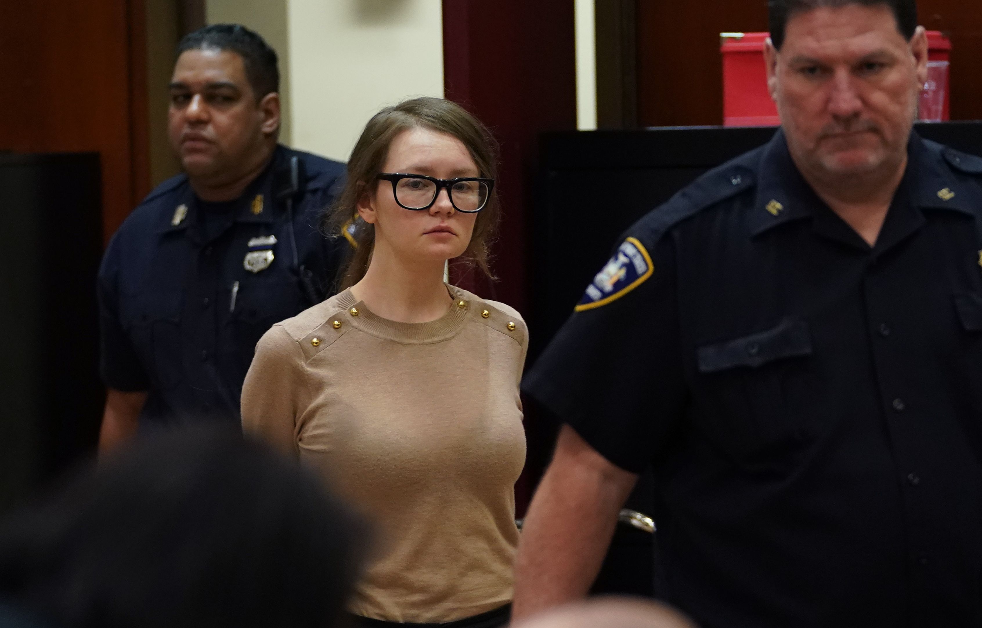 Anna Sorokin better known as Anna Delvey, the 28-year-old German national, whose family moved there in 2007 from Russia, is seen in the courtroom during her trial at New York State Supreme Court in New York on April 11, 2019. - The self-styled German �heiress� has been charged with grand larceny and theft of services charges alleging she swindled various people and businesses. (Photo by TIMOTHY A. CLARY / AFP)