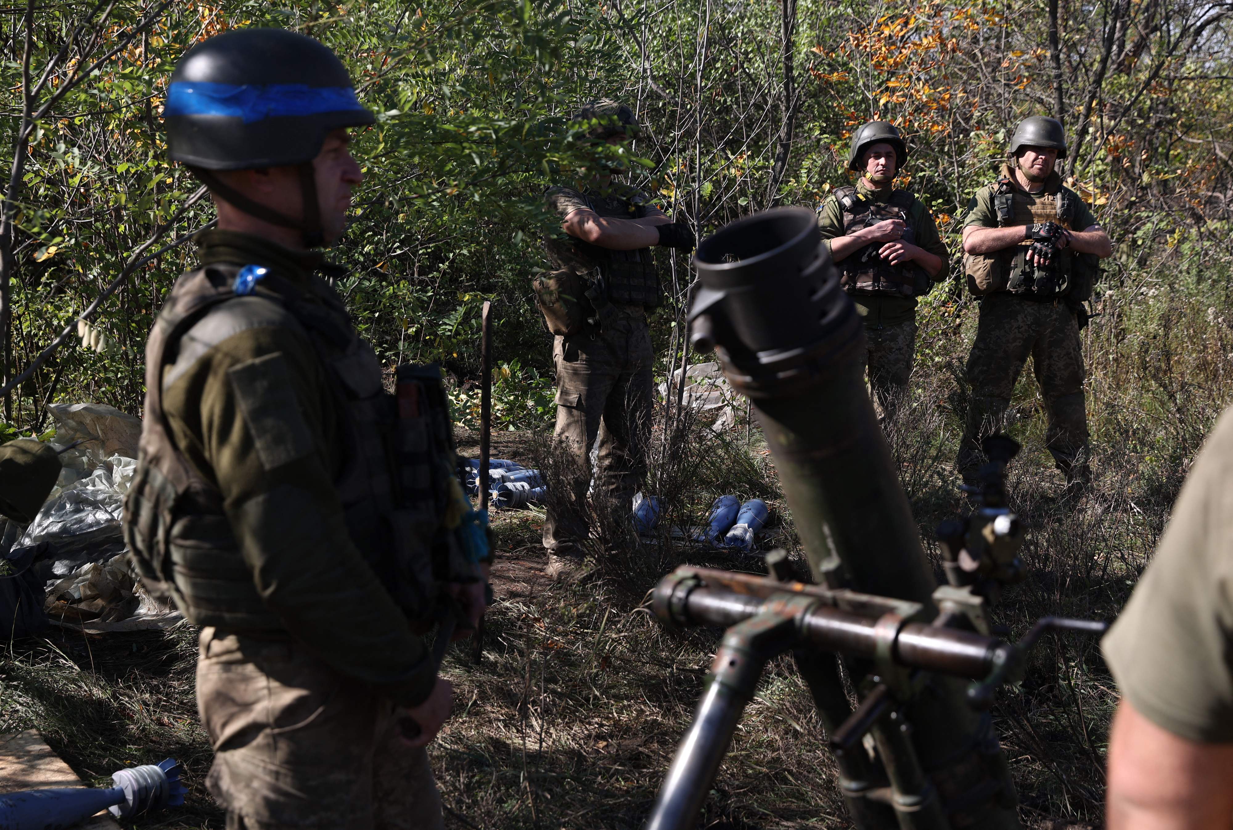 Ukrainian servicemen stand near mortar launcher at their position on the front line with Russian troops in the Donetsk region on October 5, 2022, as the Russia-Ukraine war enters its 223rd day. (Photo by Anatolii Stepanov / AFP)