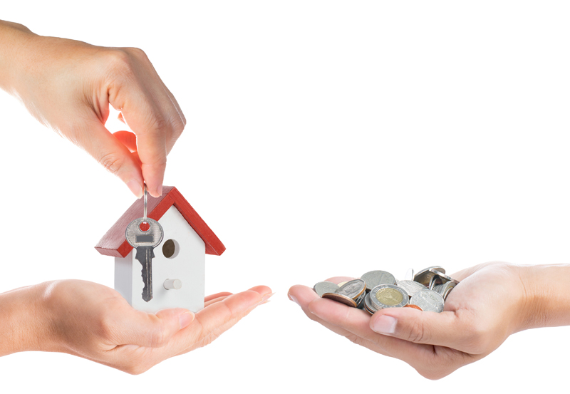 Buying property concept with giving money and key