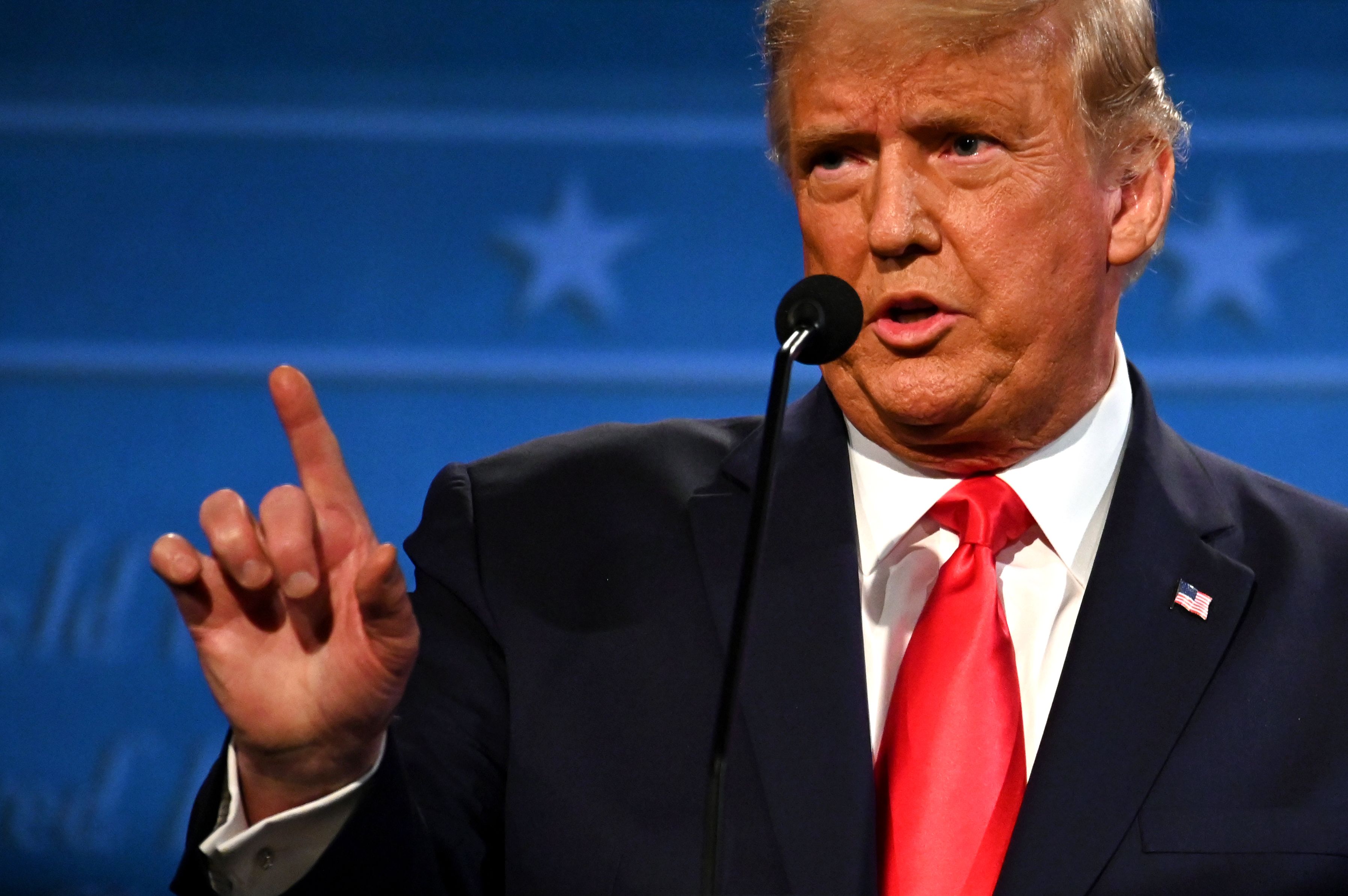 (FILES) In this file photo taken on October 22, 2020 US President Donald Trump gestures as he speaks during the final presidential debate at Belmont University in Nashville, Tennessee, on October 22, 2020. - US President Donald Trump rejected on December 22, 2020 a new Covid-19 relief package approved by lawmakers, calling it "a disgrace". (Photo by JIM WATSON / AFP)