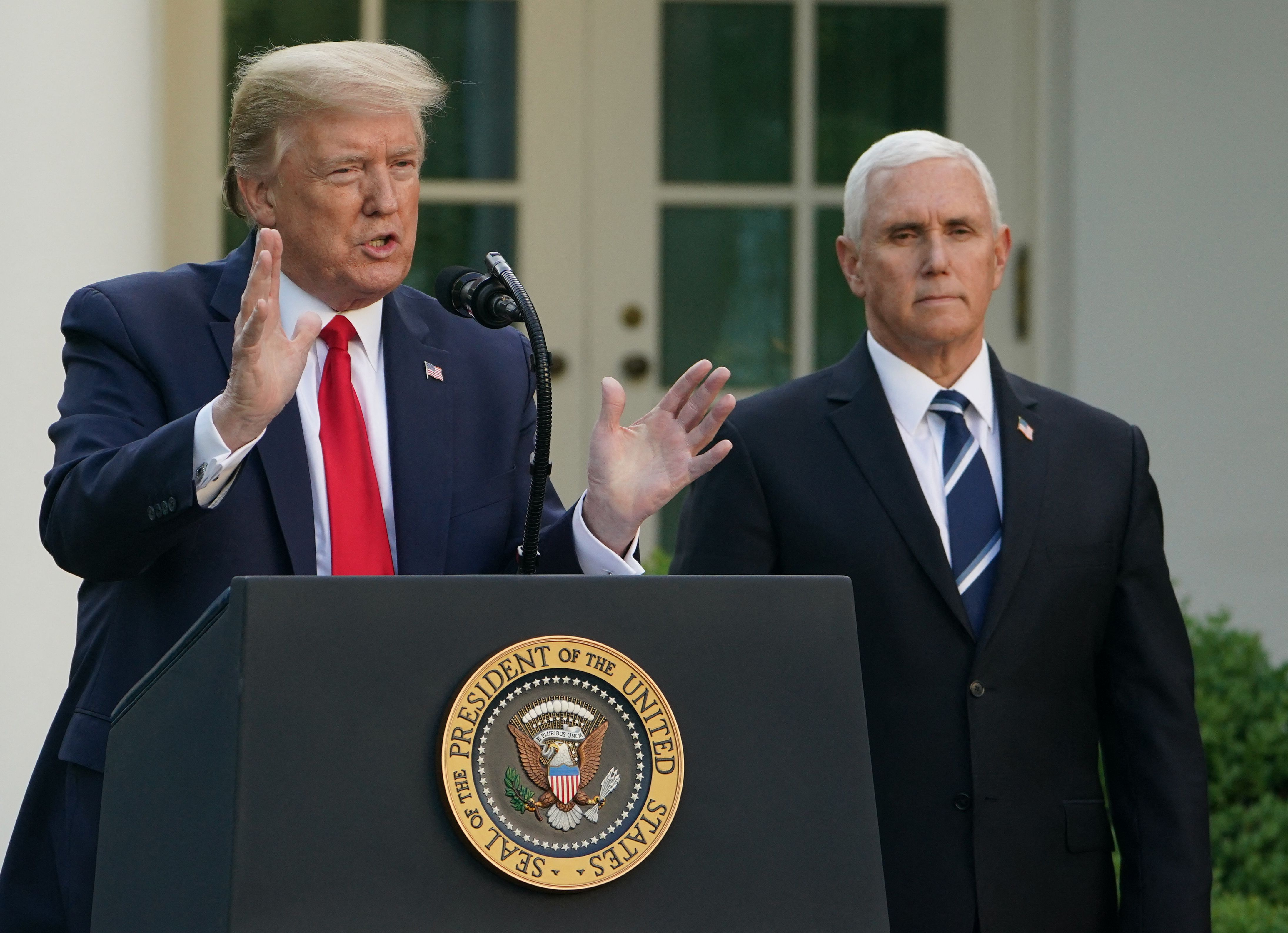 (FILES) In this file photo taken on April 27, 2020 US President Donald Trump speaks as US Vice President Mike Pence look on during a news conference on the novel coronavirus, COVID-19, in the Rose Garden of the White House in Washington, DC. - Former US vice president Mike Pence said on February 4, 2022 that he had no right to overturn the 2020 election and former president Donald Trump was wrong to claim he could have done so. (Photo by MANDEL NGAN / AFP)
