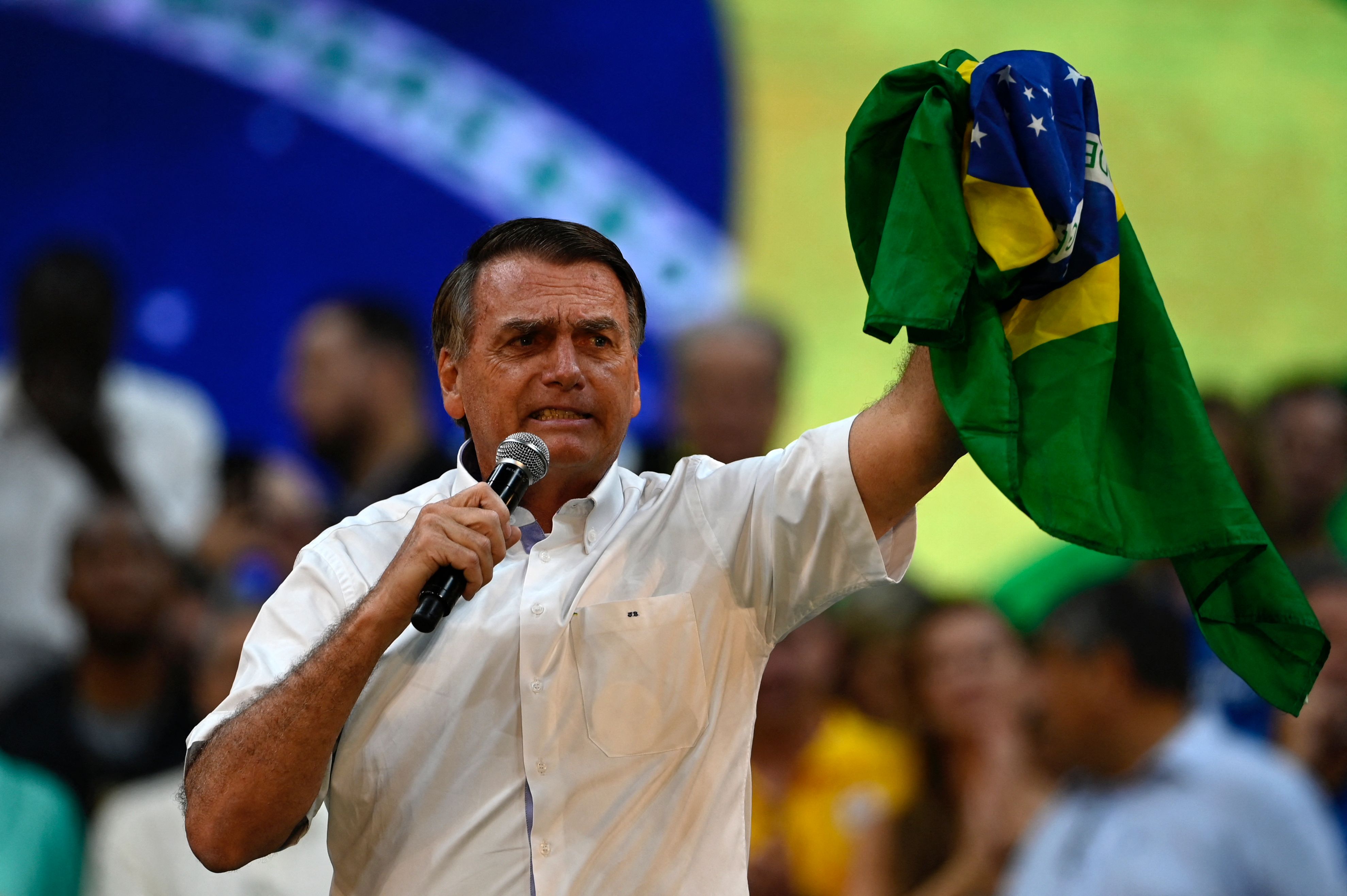 Brazil�s President Jair Bolsonaro gestures during the Liberal Party (PL) national convention where he was officially appointed as candidate for re-election, at the Maracanazinho gymnasium in Rio de Janeiro, Brazil, on July 24, 2022. (Photo by MAURO PIMENTEL / AFP)