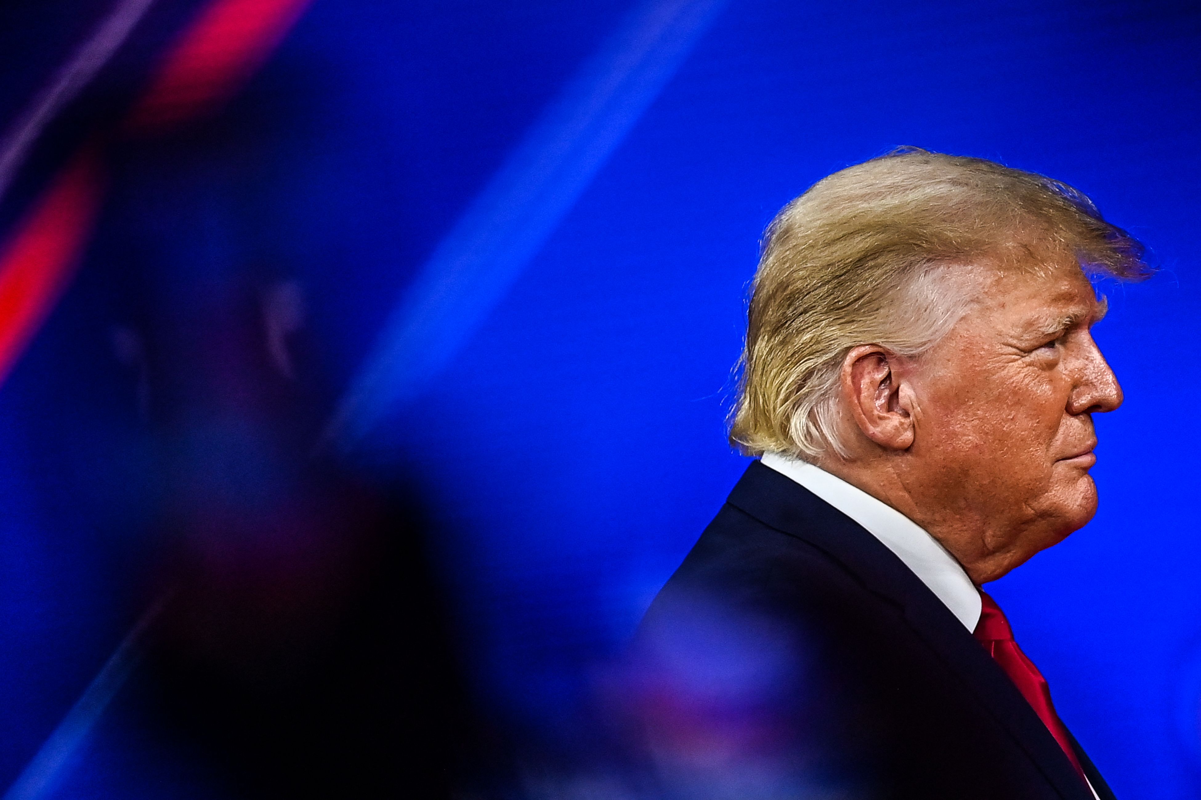 (FILES) In this file photo taken on February 26, 2022, former US President Donald Trump arrives to speak at the Conservative Political Action Conference 2022 (CPAC) in Orlando, Florida. - A private plane carrying former US president Donald Trump was forced to make an emergency landing after developing engine failure over the weekend, US media reported on March 9, 2022. (Photo by CHANDAN KHANNA / AFP)