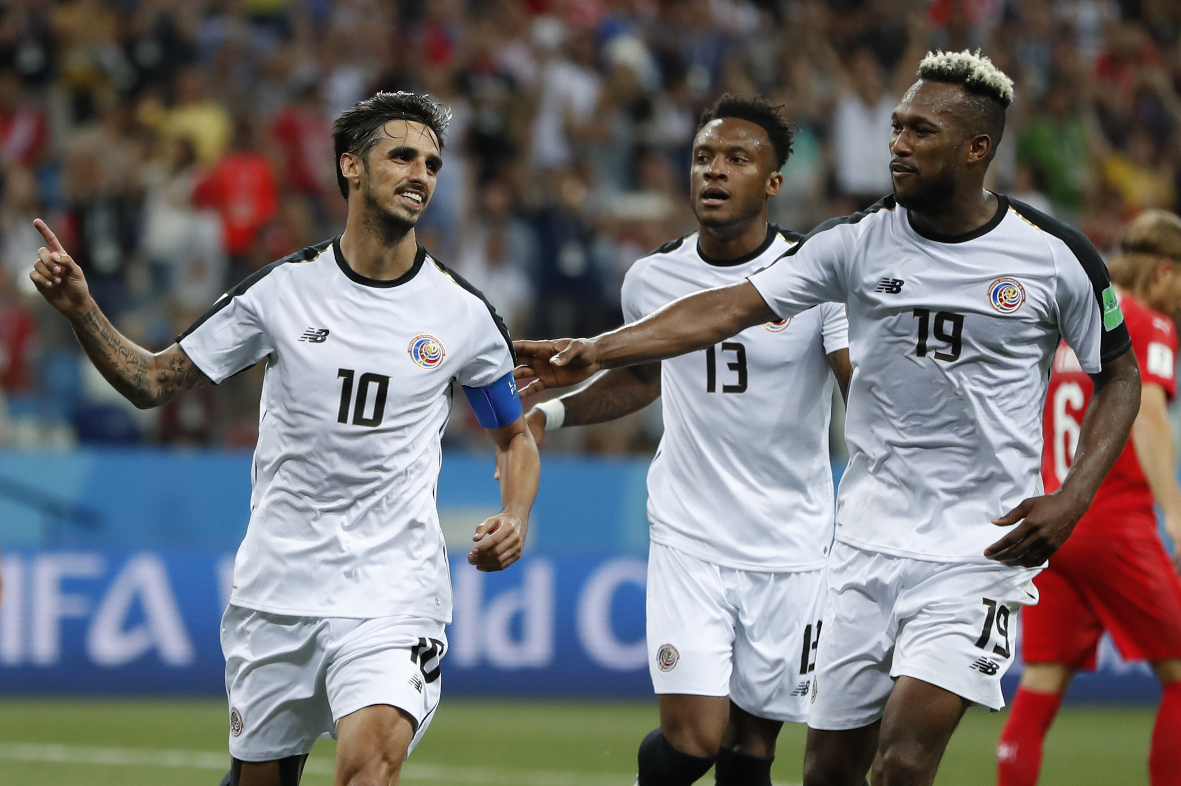 Costa Rica's Bryan Ruiz, left, celebrates with his teammates Rodney Wallace, center, and Kendall Waston after scoring his side's second goal during the group E match between Switzerland and Costa Rica, at the 2018 soccer World Cup in the Nizhny Novgorod Stadium in Nizhny Novgorod , Russia, Wednesday, June 27, 2018. (AP Photo/Natasha Pisarenko)