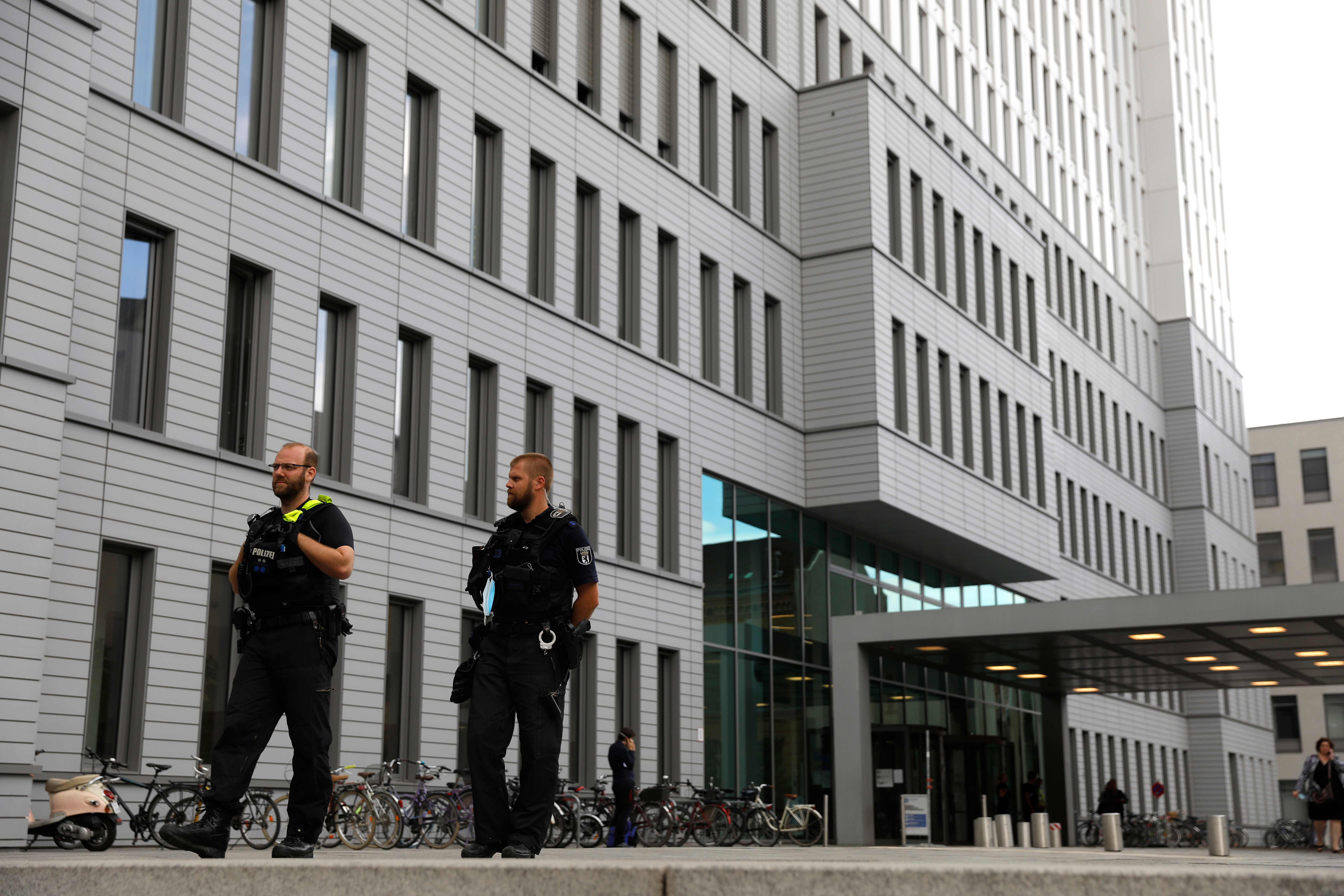 German police officers stand guard outside Berlin's Charite hospital on August 24, 2020, where Alexei Navalny is treated after his medical evacuation to Germany following a poisoning. - Tests carried out on Russian opposition figure Alexei Navalny indicate poisoning, according to Berlin's Charite hospital where he was admitted for treatment at the weekend. "The clinical findings indicate intoxication by a substance from the cholinesterase inhibitor group," the hospital said in a statement on August 24, 2020. (Photo by Odd ANDERSEN / AFP)