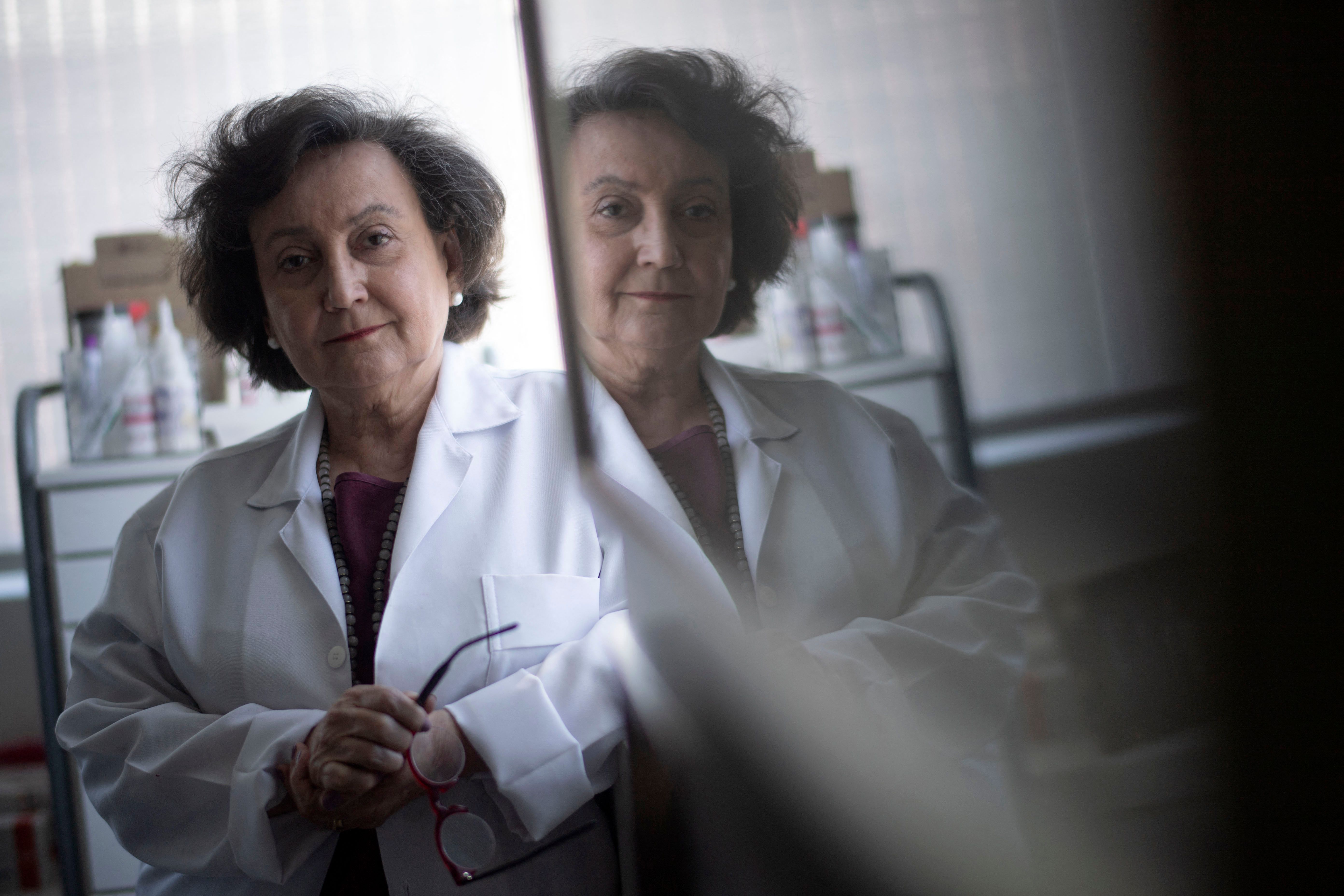 Pneumologist's physician Margareth Dalcolmo poses for a photograph at her medical office in Rio de Janeiro, Brazil on March 9, 2021. - Dalcolmo, a 65-year-old pulmonologist, was an unknown researcher at public health institute Fiocruz when Covid-19 arrived in Brazil in February 2020. But the soft-spoken expert has since made hundreds of media appearances on the health crisis, emerging as a comforting, almost motherly source of information in a country where disinformation and science-bashing are spreading as fast as the virus (Photo by Mauro Pimentel / AFP)
