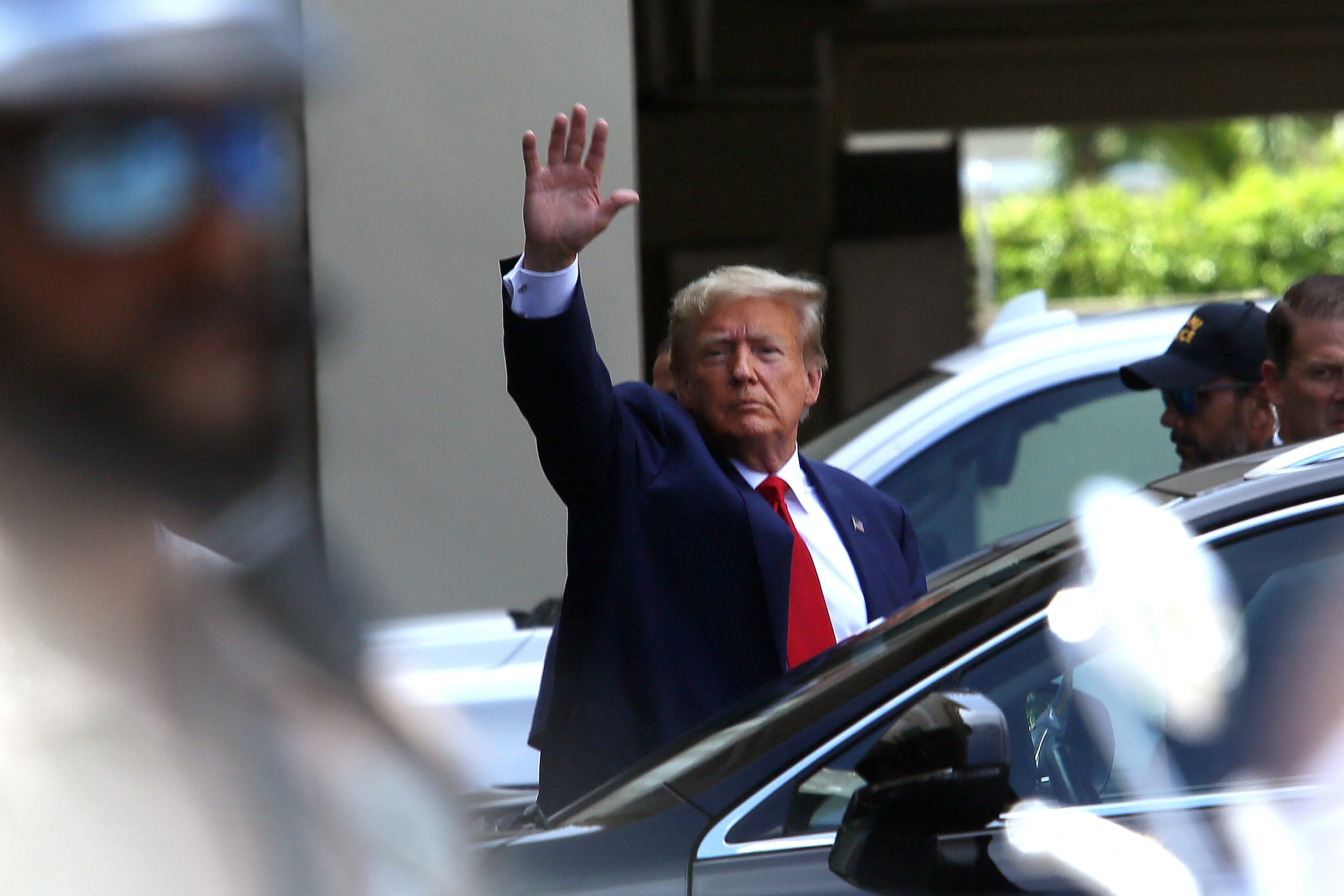 MIAMI, FLORIDA - JUNE 13: Former U.S. President Donald Trump waves as he makes a visit to the Cuban restaurant Versailles after he appeared for his arraignment on June 13, 2023 in Miami, Florida. Trump pleaded not guilty to 37 federal charges including possession of national security documents after leaving office, obstruction, and making false statements. Alon Skuy/Getty Images/AFP (Photo by Alon Skuy / GETTY IMAGES NORTH AMERICA / Getty Images via AFP)