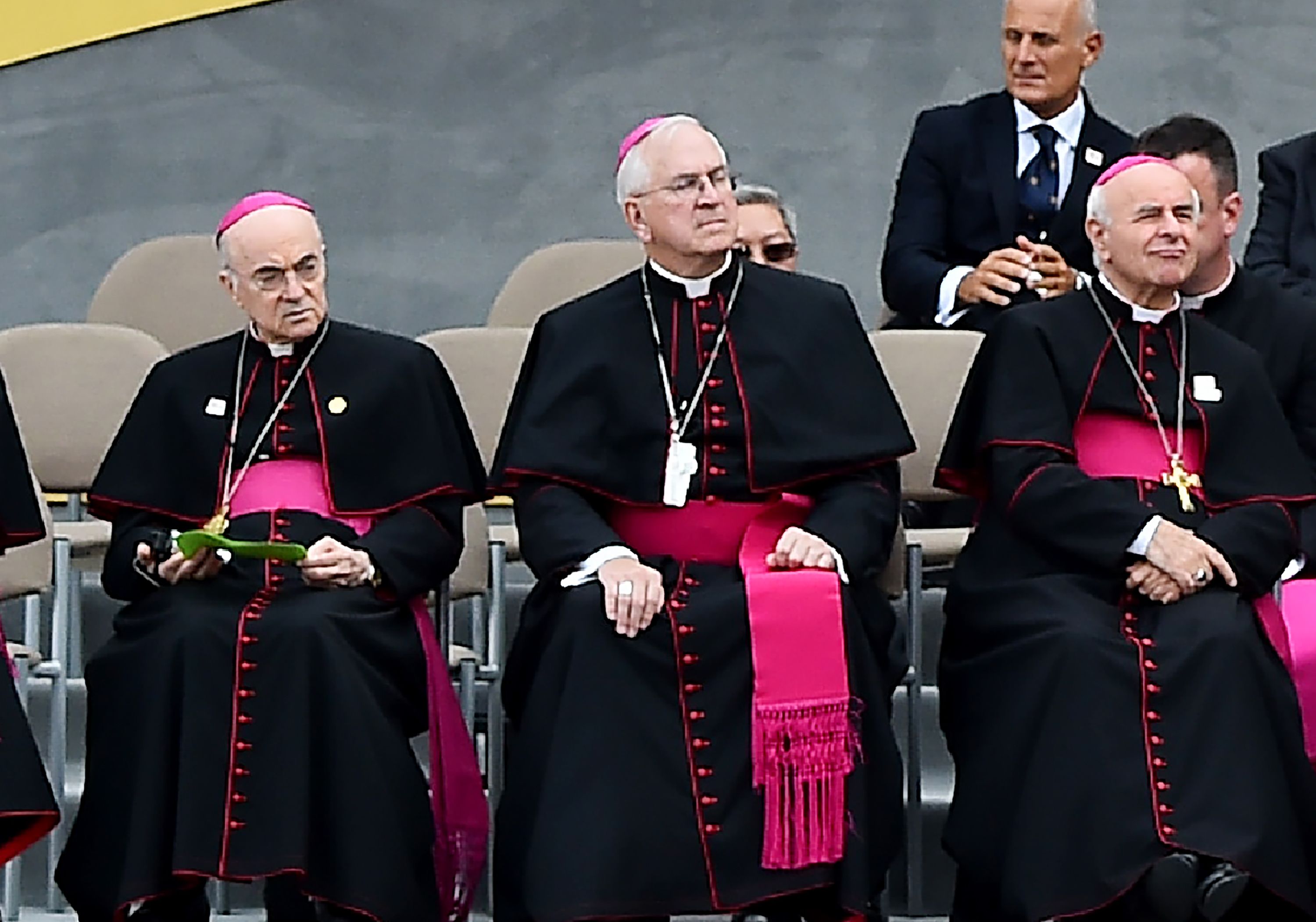 Ambassador to the Vatican Carlo Maria Vigano (L) and Vincenzo Paglia (R) listen to Pope Francis speaking at Independence Hall in Philadelphia on September 26, 2015. - A former ambassador to the Vatican has accused Pope Francis of ignoring sexual abuse claims against prominent US cardinal Theodore McCarrick, who was forced to resign last month. Archbishop Carlo Maria Vigano said that he had told Francis, who is currently visiting Ireland, of the allegations in 2013, but that the pontiff instead lifted sanctions imposed on McCarrick by predecessor Pope Benedict. Vigano's eleven-page letter was published simultaneously on August 25, 2018 in several conservative Catholic publications in the US. (Photo by VINCENZO PINTO / AFP)