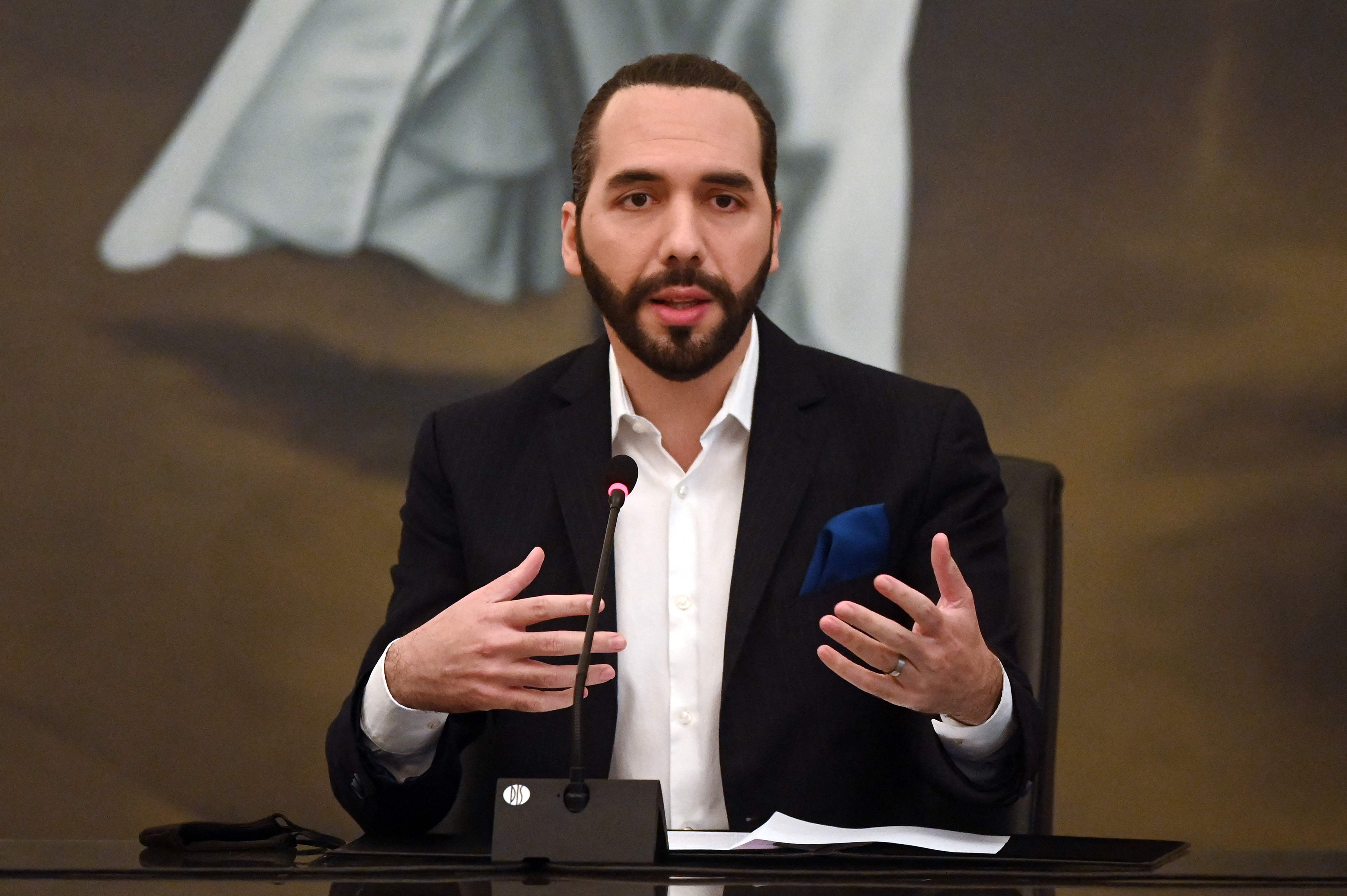 (FILES) In this file photo taken on February 22, 2021 Salvadoran President Nayib Bukele speaks during the beginning of the delivery of computers to students of the public sector, at the presidential house in San Salvador. - June 1, 2021 is the second anniversary of Nayib Bukele in the Salvadoran government, with high levels of popularity and the reduction of homicides as an achievement but international condemnation for concentrating power since his allies in the Congress dismissed magistrates of the Supreme Court of Justice and a general public prosecutor. (Photo by MARVIN RECINOS / AFP)