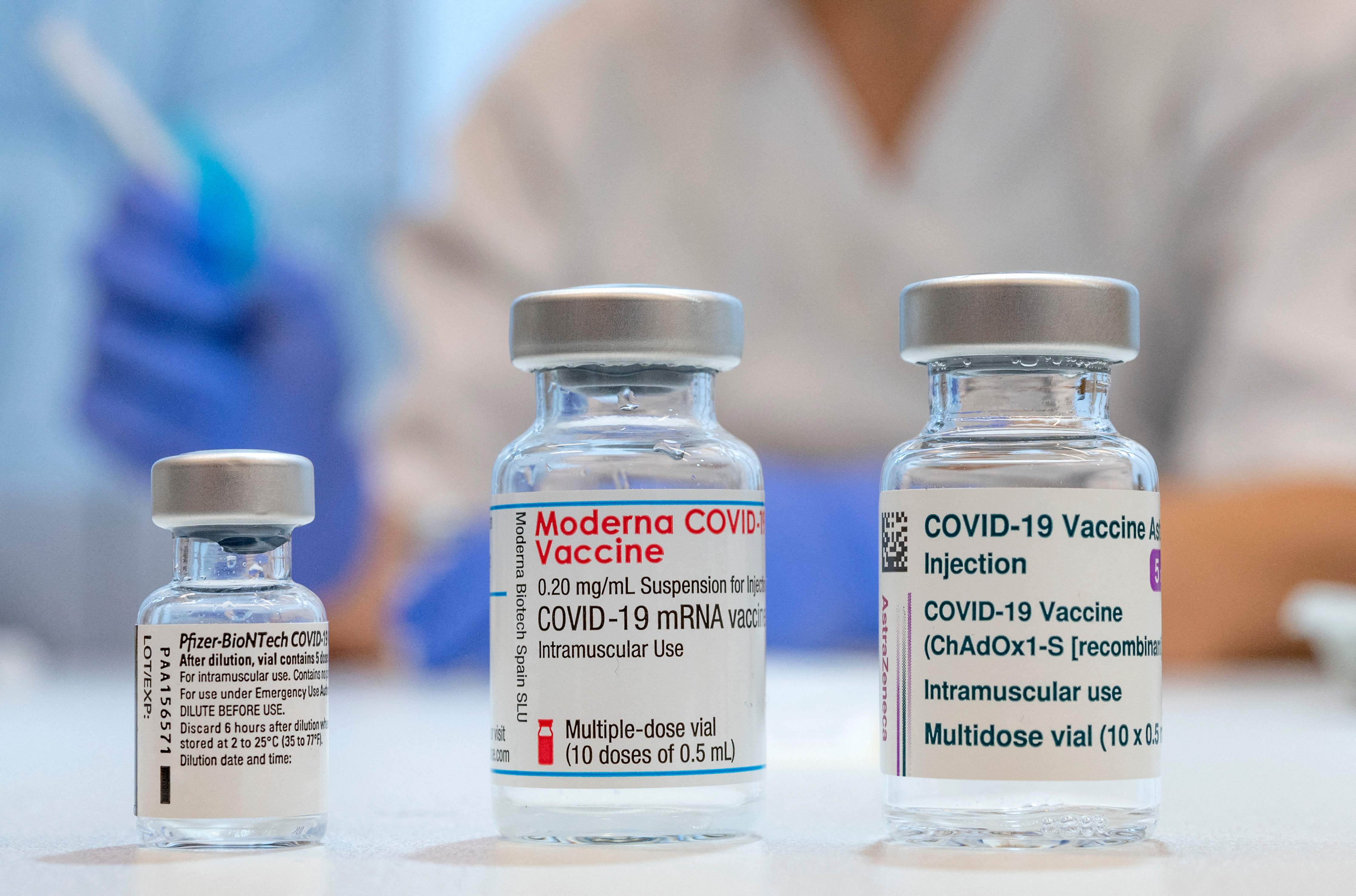 Used vaccine vials that contained (L-R) Pfizer-BioNTech, Moderna and AstraZeneca Covid-19 vaccines are pictured at the Skane University Hospital vaccination centre in Malmo, Sweden, on February 17, 2021. (Photo by Johan NILSSON / TT NEWS AGENCY / AFP) / Sweden OUT