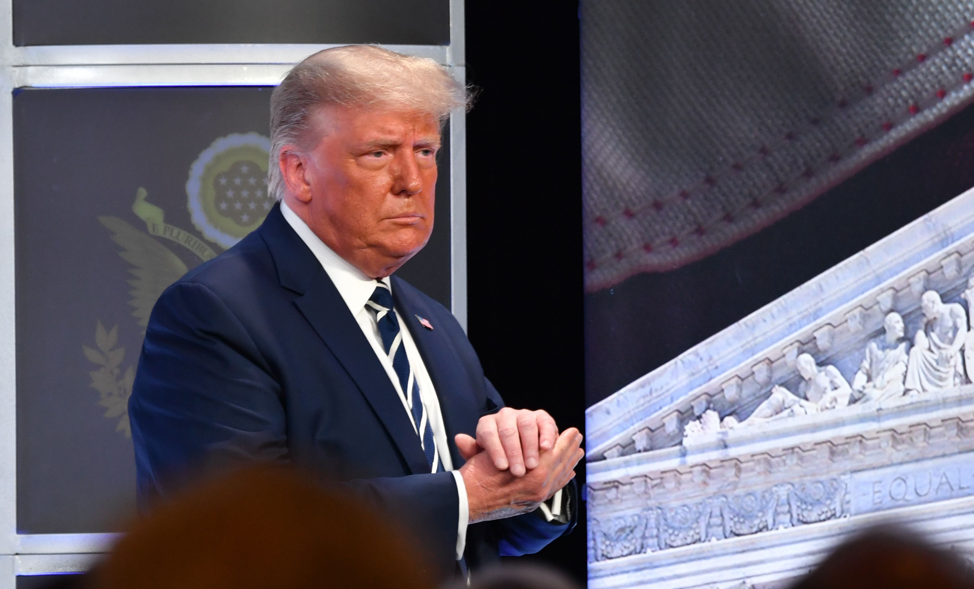 US President Donald Trump looks on as he leaves after delivering remarks at the 2020 Council for National Policy Meeting at the Ritz Carlton in Pentagon City in Arlington, Virginia on August 21, 2020. (Photo by Nicholas Kamm / AFP)