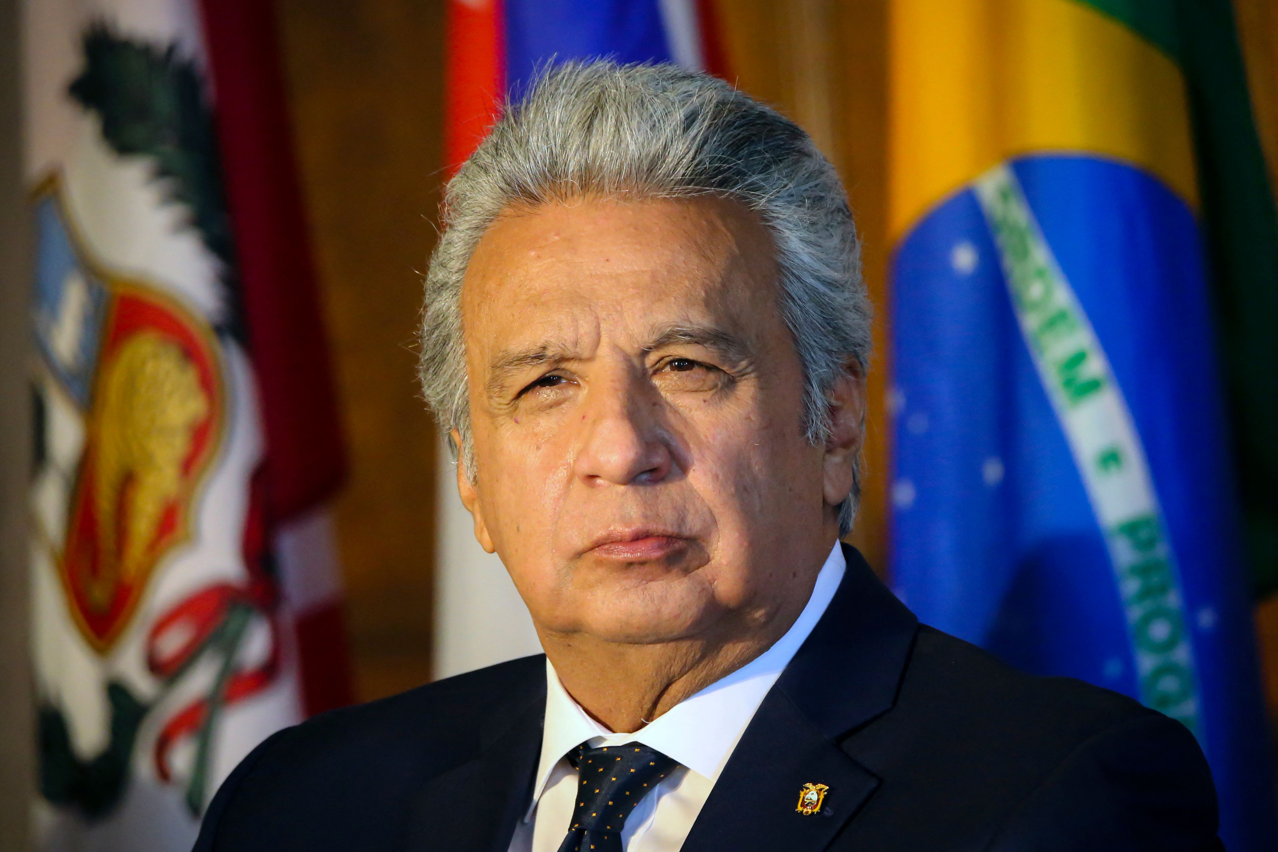 (FILES) In this file photo taken on May 5, 2021, Ecuador's President Lenin Moreno listens during Inter-American Institute for Democracy Forum "Defence of Democracy in the Americas" in Miami, Florida. - The Ecuadoran public prosecutor's office said on July 25, 2022, it is investigating former president Lenin Moreno over the disappearance of priceless artifacts from the presidential palace. The public prosecutor's office said on Twitter it was searching Moreno's home "in the context of an investigation into the alleged crime of embezzlement related to the alleged disappearance of heritage pieces" from the government building. (Photo by Eva Marie UZCATEGUI / AFP)