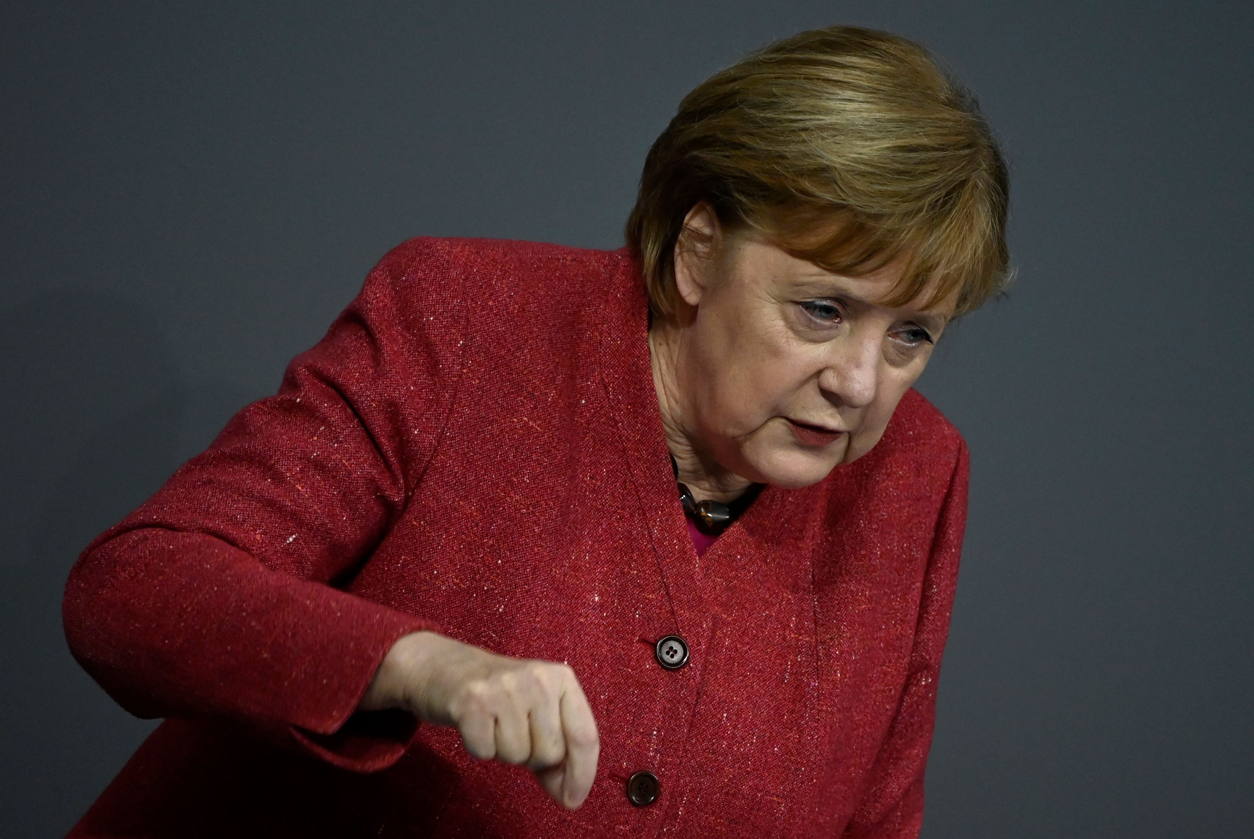 German Chancellor Angela Merkel gestures as she speaks during a debate at the Bundestag (lower house of parliament) in Berlin on December 9, 2020, on the eve of a EU summit. (Photo by Tobias SCHWARZ / AFP)