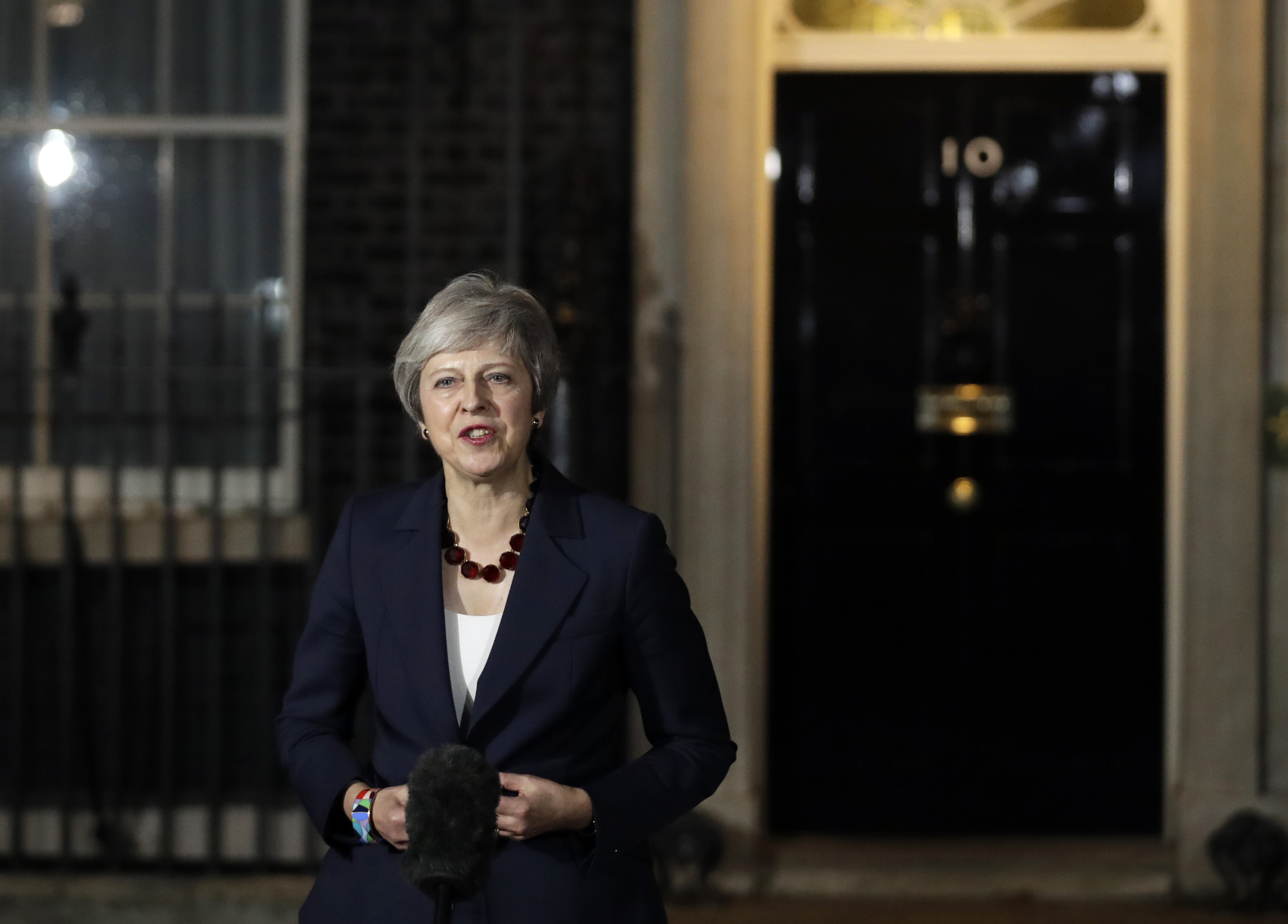 Britain's Prime Minister Theresa May delivers a speech outside 10 Downing Street in London, Wednesday, Nov. 14, 2018. British Prime Minister Theresa May says Cabinet agrees draft Brexit deal with European Union after 'impassioned' debate. (AP Photo/Matt Dunham)