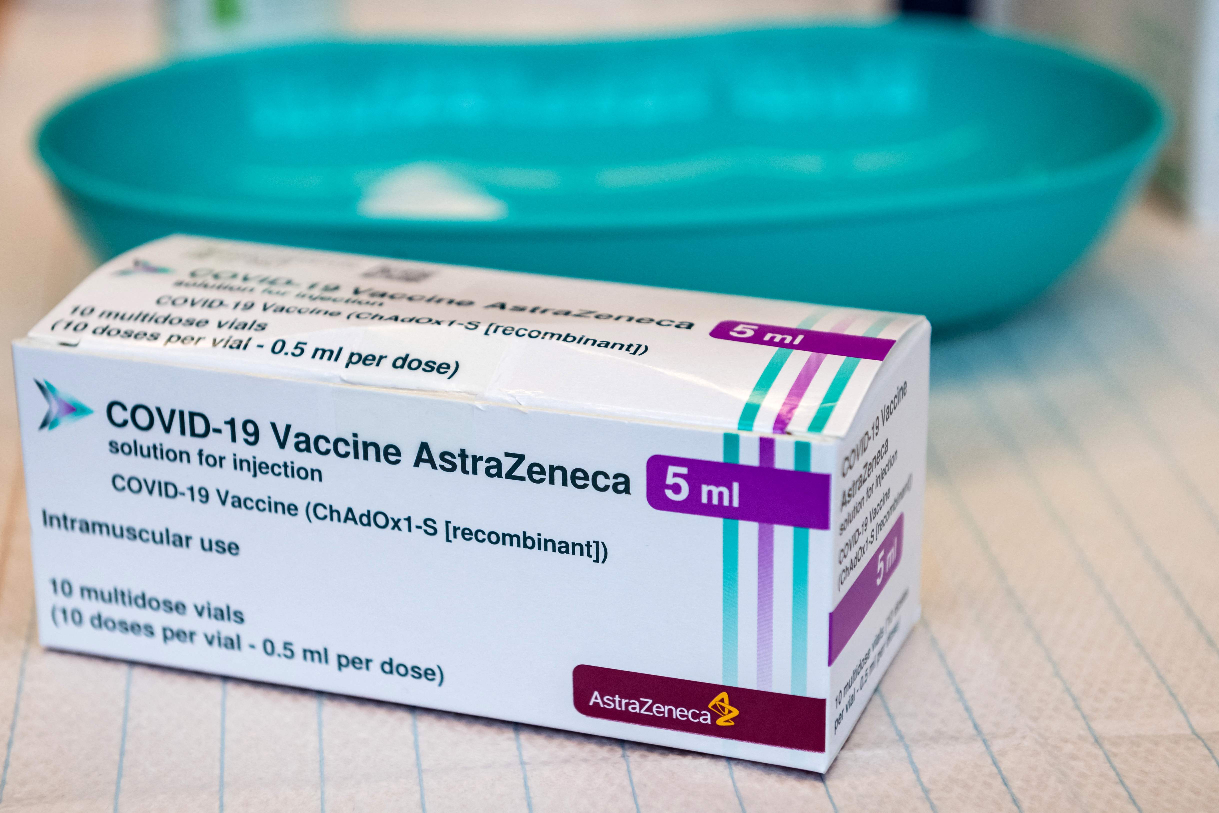 (FILES) This file photo taken on February 12, 2021 shows a box of AstraZeneca's Covid-19 vaccine at the university hospital, at the start of the inoculation with the AstraZeneca vaccine at the hospital, in Halle/Saale, eastern Germany. - Lithuania on March 16, 2021 followed more than a dozen other countries in suspending AstraZeneca vaccinations pending checks by the European Medicines Agency (EMA). Health Minister Arunas Dulkys said the vaccine will not be used as a precaution "until the European Medicines Agency provides its final conclusions over its safety". (Photo by JENS SCHLUETER / AFP)