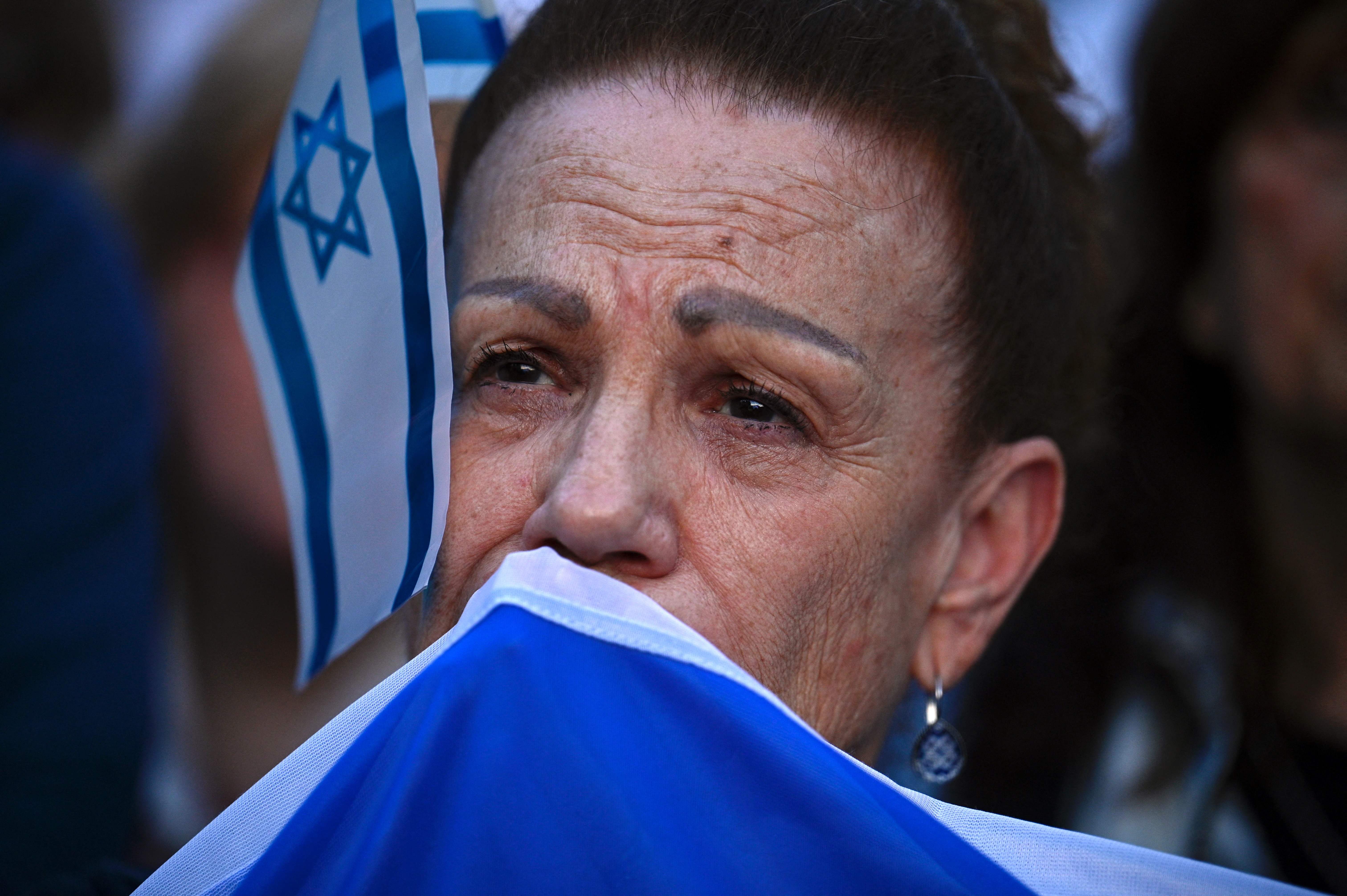 A woman takes part in a rally in support of the people of Israel, in Buenos Aires on October 9, 2023, following the October 7 shock deadly attack on Israel by Palestinian militant group Hamas. (Photo by Luis ROBAYO / AFP)