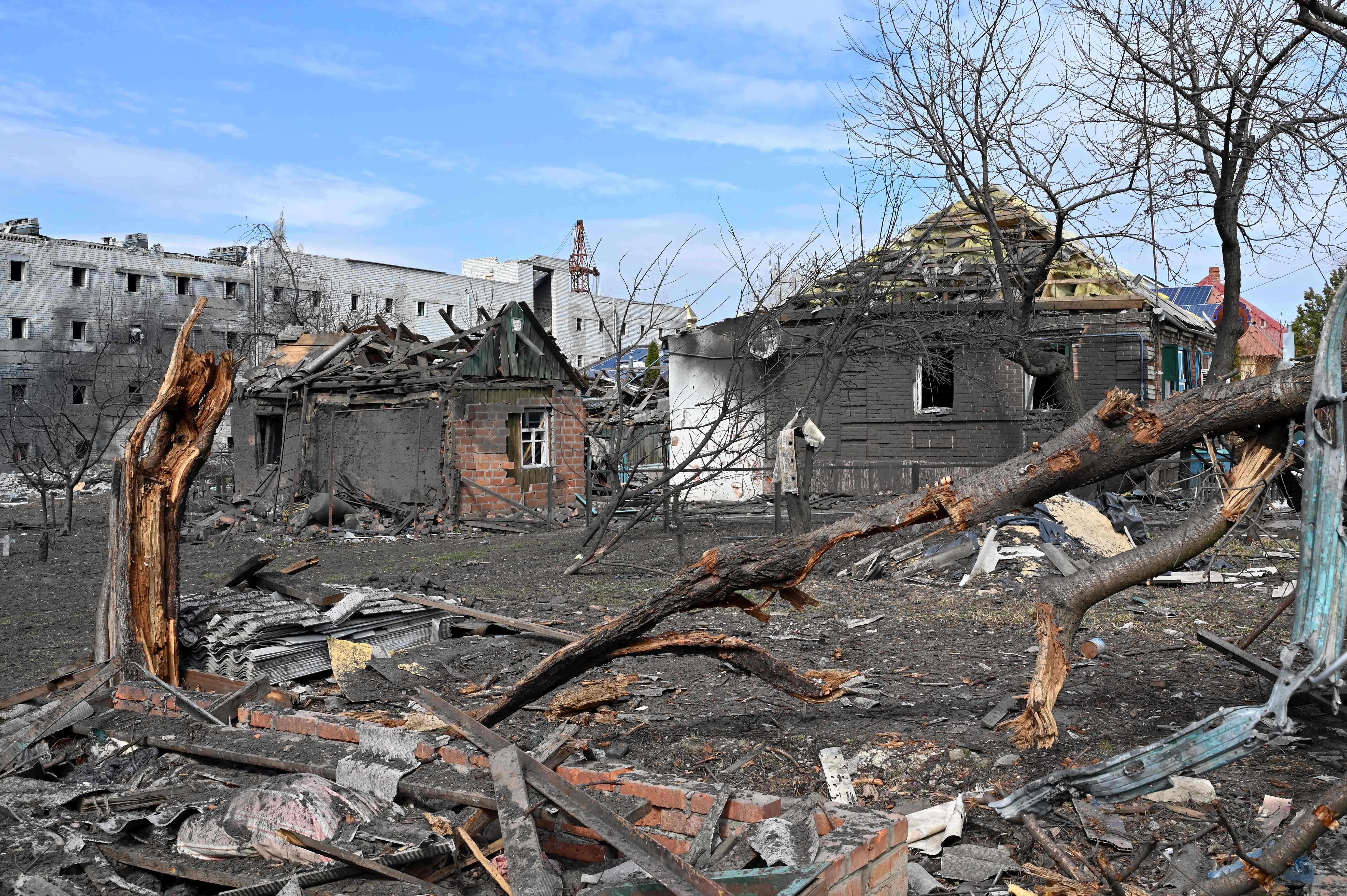A photograph shows destroyed buildings in Kharkiv on March 29, 2022, destroyed by Russian troops shelling, on the 34th day of the Russian invasion of Ukraine. - Ukraine is calling for an "international agreement" to guarantee its security, which would be signed by several guarantor countries, said on March 29, 2022 the Ukrainian chief negotiator after several hours of Russian-Ukrainian talks in Istanbul. (Photo by Sergey BOBOK / AFP)