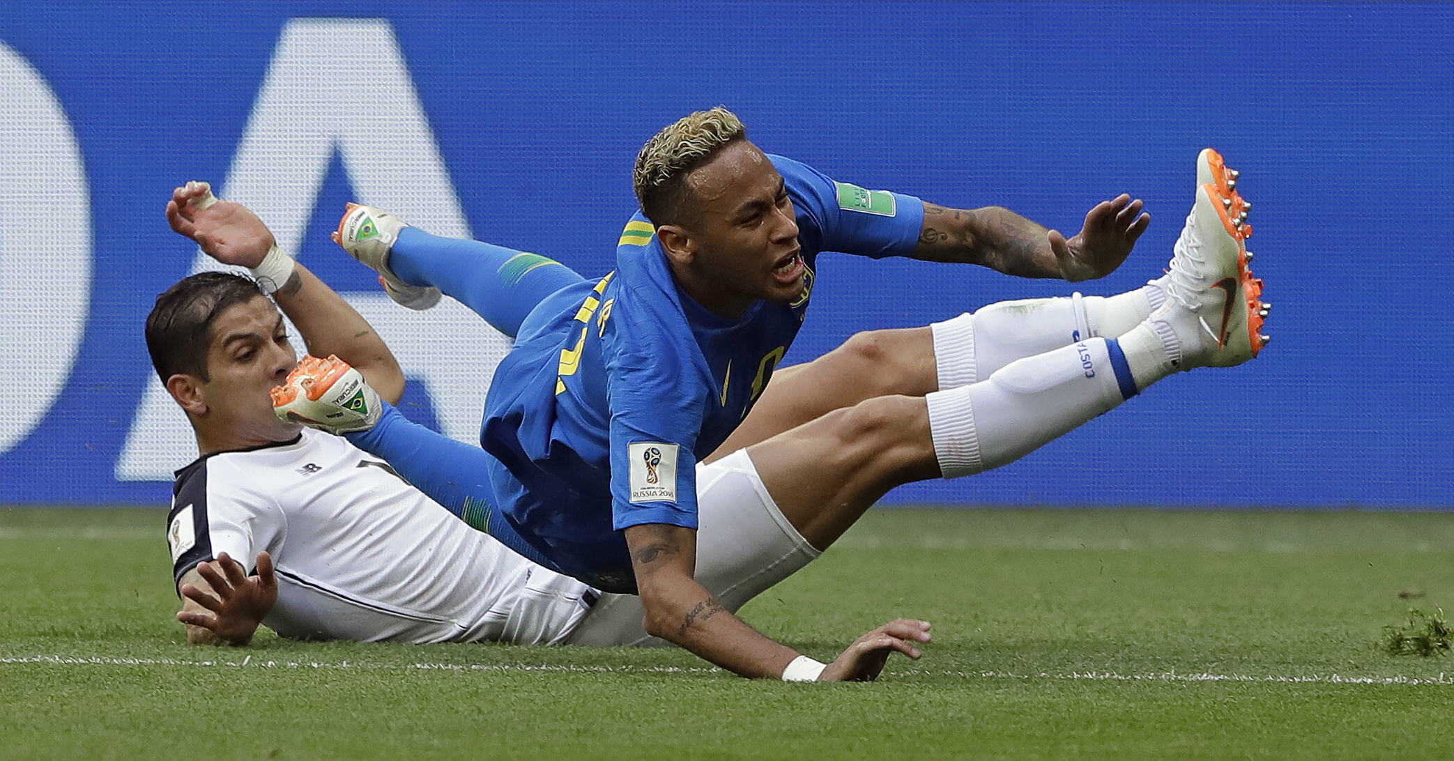Brazil's Neymar is brought down by Costa Rica's Cristian Gamboa during the group E match between Brazil and Costa Rica at the 2018 soccer World Cup in the St. Petersburg Stadium in St. Petersburg, Russia, Friday, June 22, 2018. (AP Photo/Andre Penner)
