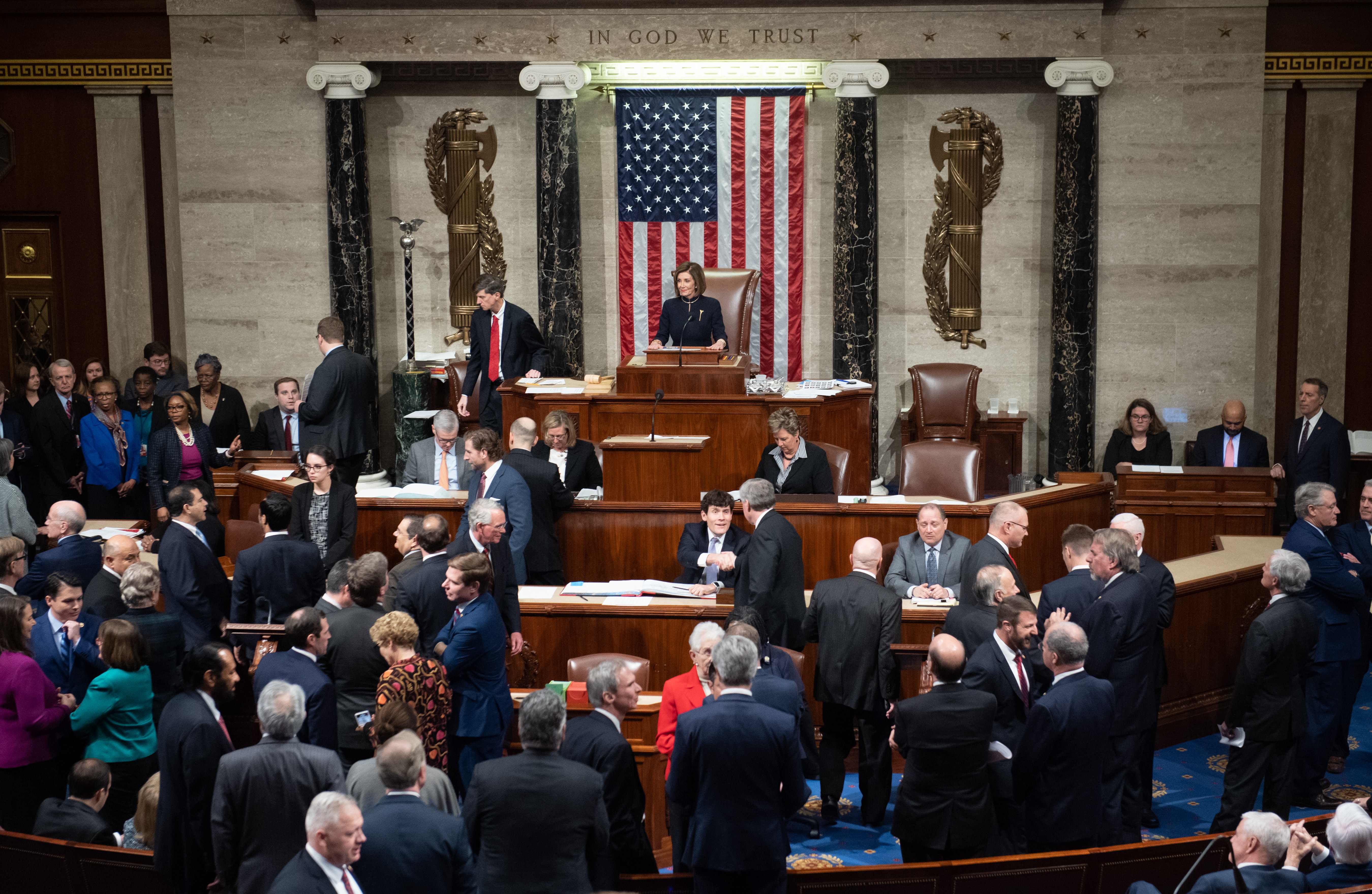 TOPSHOT - US Speaker of the House Nancy Pelosi presides over Resolution 755, Articles of Impeachment Against President Donald J. Trump as the House votes at the US Capitol in Washington, DC, on December 18, 2019. - The US House of Representatives voted 229-198 on Wednesday to impeach President Donald Trump for obstruction of Congress. The House impeached Trump for abuse of power by a 230-197 vote. The 45th US president is just the third occupant of the White House in US history to be impeached. (Photo by SAUL LOEB / AFP)