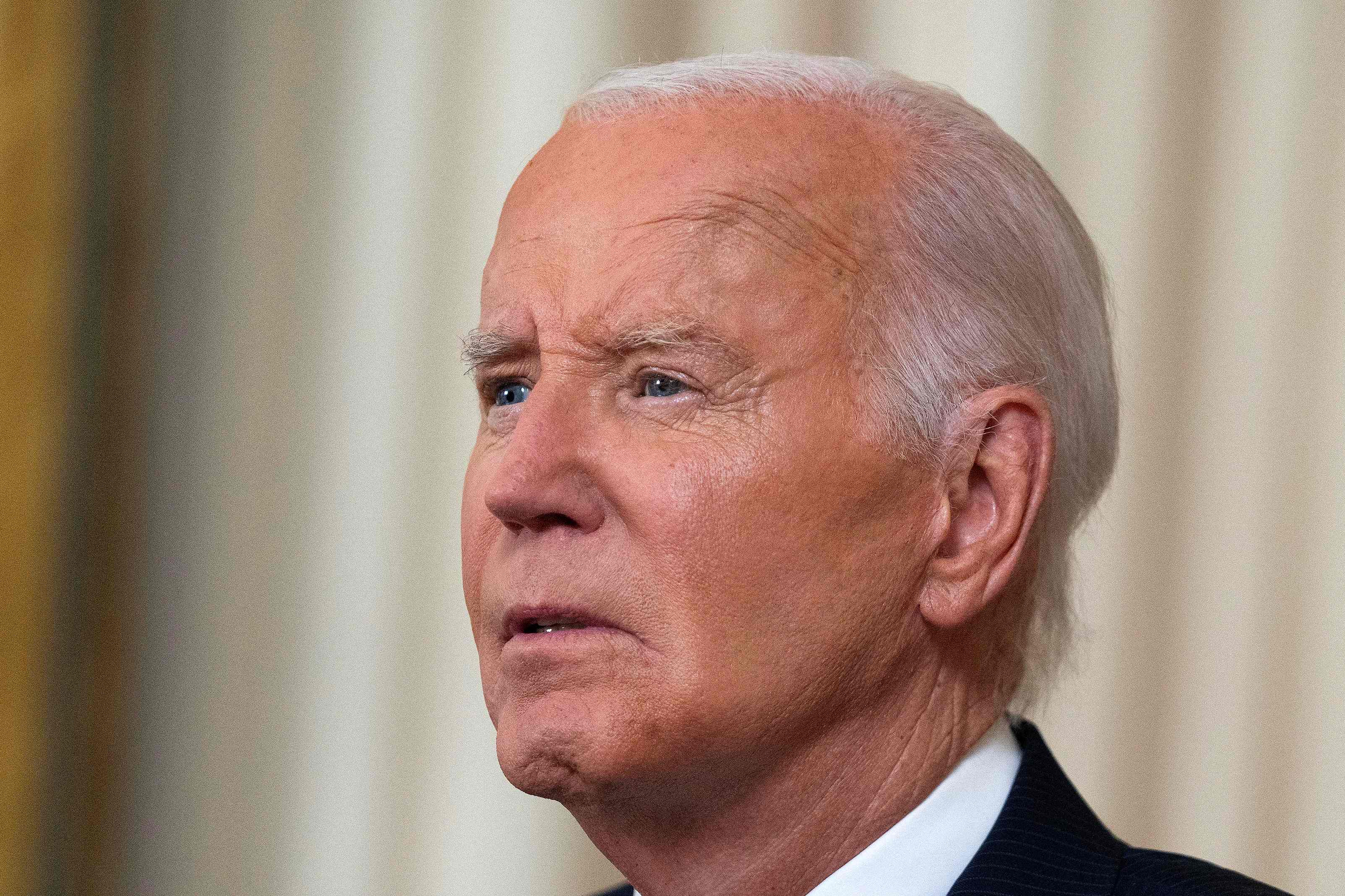 TOPSHOT - US President Joe Biden pauses as he concludes his speech to the nation about his decision to not seek reelection, in the Oval Office at the White House in Washington, DC, on July 24, 2024. US President Joe Biden will give an Oval Office speech July 24, 2024 to explain his historic decision to drop out of the 2024 election and pass the torch to Kamala Harris, with the White House denying any cover up over his health. In his first address to the nation since quitting the race, the 81-year-old is expected to burnish his legacy and deny he will spend six months as a lame duck president. (Photo by Evan Vucci / POOL / AFP)