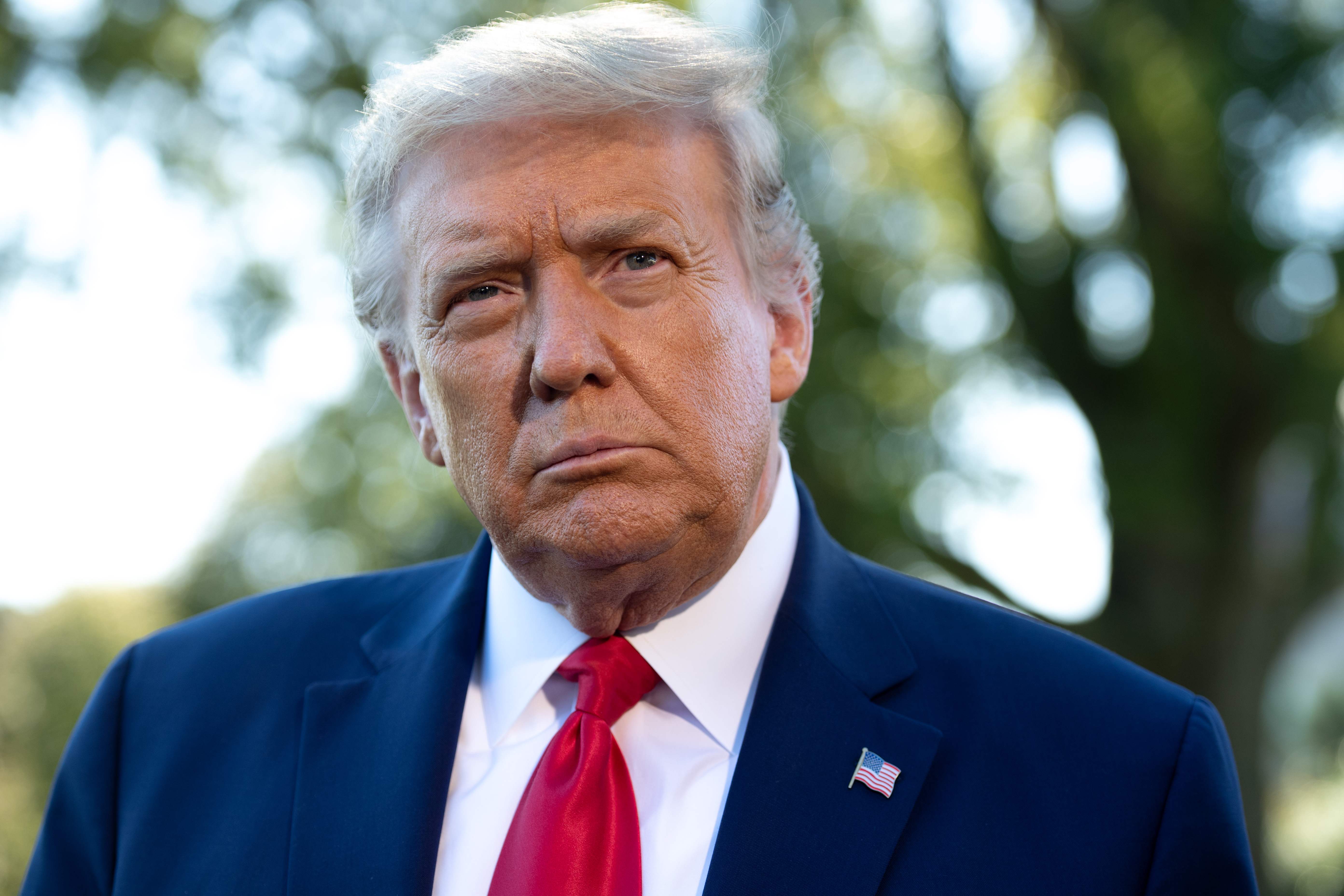 (FILES) In this file photo former US President Donald Trump speaks to the media prior to departing from the South Lawn of the White House in Washington, DC, September 21, 2020, as he travels to Ohio. - He's gone, he's golfing, but from his palm lined Florida hideaway Donald Trump is also plotting revenge. If many Americans -- perhaps discreetly including a number of senior Republicans -- wished Trump would just disappear at his Mar-a-Lago resort in Palm Beach, they're in for a sore disappointment.As an impeachment trial clanks into gear in Washington, the disgraced ex-president is making clear to Republican senators that they need to remember he is a major force. An announcement on January 25, 2021 that he was opening "the Office of the Former President" in his new hometown reminded them. (Photo by SAUL LOEB / AFP)