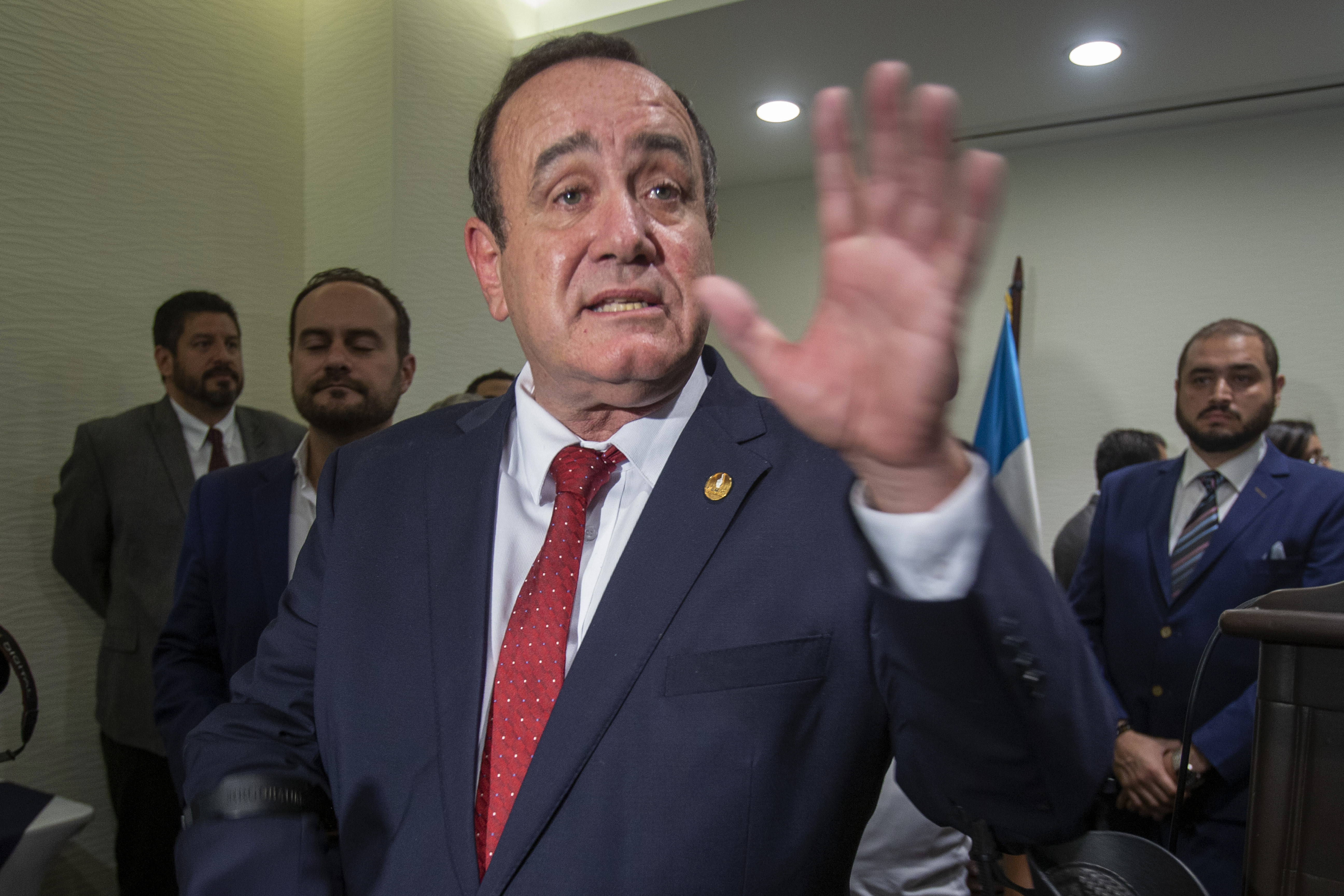 Alejandro Giammattei, presidential candidate of the Vamos political party, speaks with reporters during a press conference prior to June 16 general elections, in Guatemala City, Thursday, June 13, 2019. (AP Photo/Moises Castillo)