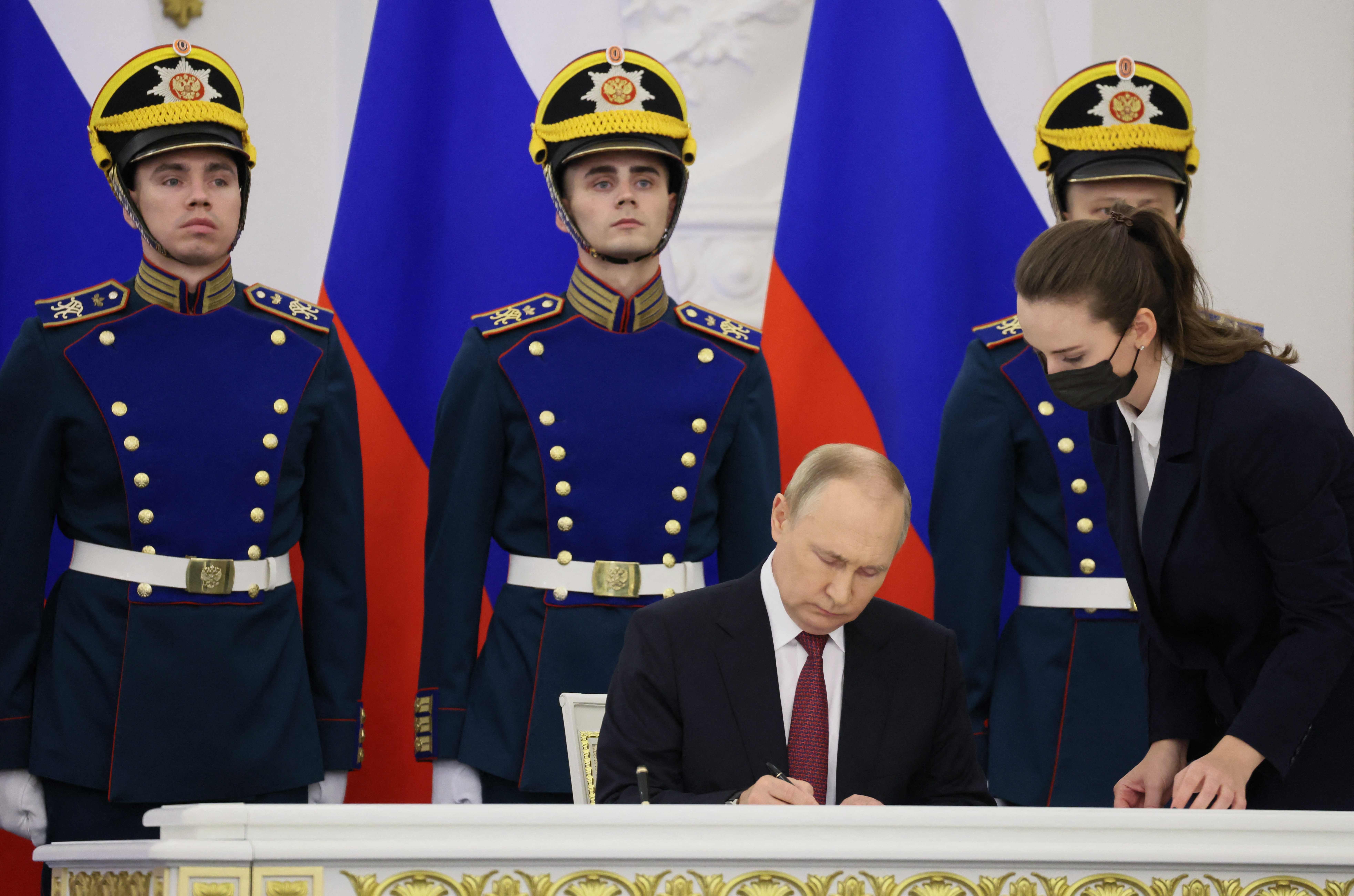 Russian President Vladimir Putin signs treaties formally annexing four regions of Ukraine Russian troops occupy - Lugansk, Donetsk, Kherson and Zaporizhzhia, at the Kremlin in Moscow on September 30, 2022. (Photo by Mikhail METZEL / SPUTNIK / AFP)