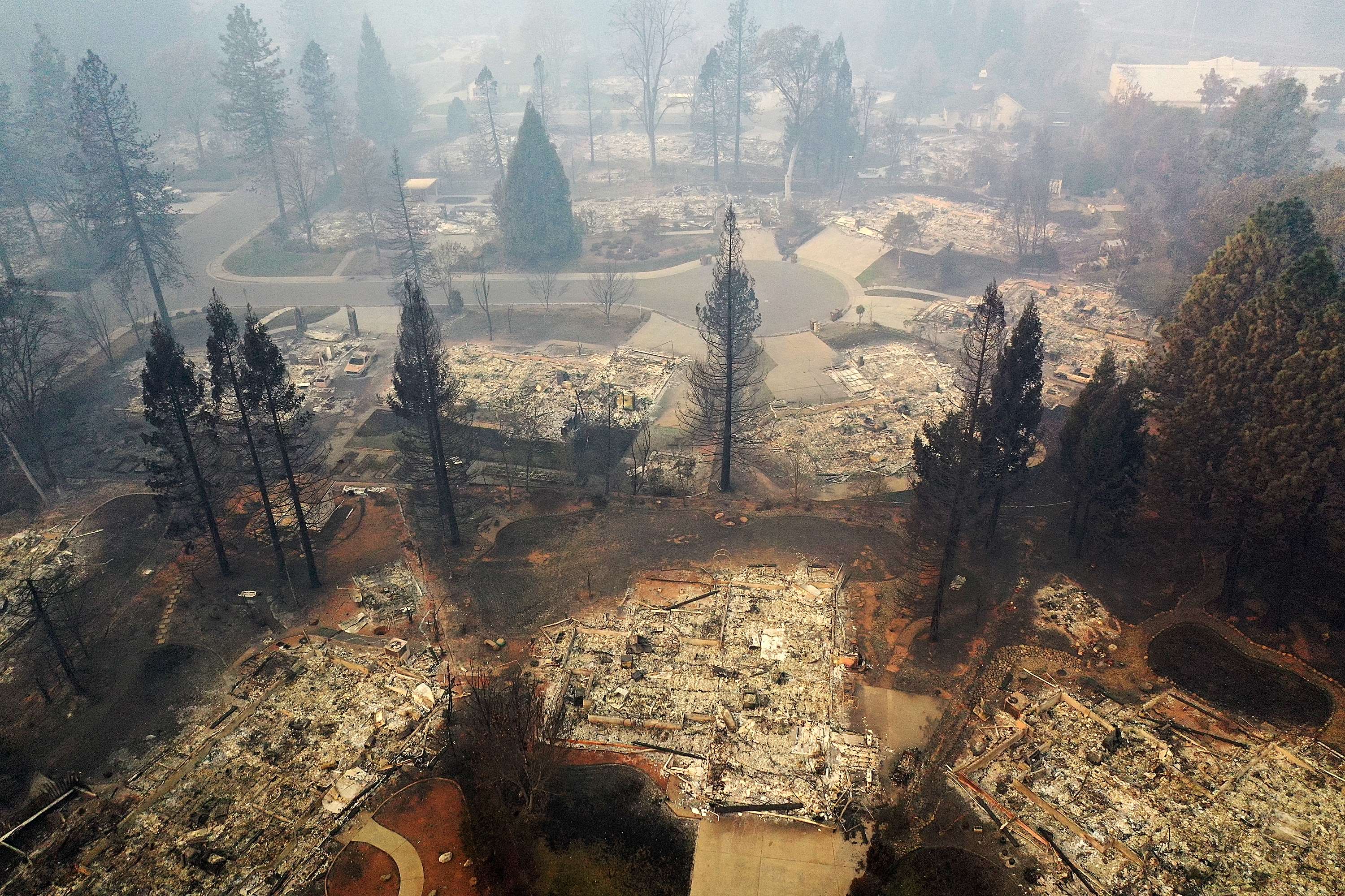 PARADISE, CA - NOVEMBER 15: An aerial view of a neighborhood destroyed by the Camp Fire on November 15, 2018 in Paradise, California. Fueled by high winds and low humidity the Camp Fire ripped through the town of Paradise charring over 140,000 acres, killing at least 56 people and destroying over 8,500 homes and businesses. The fire is currently at 40 percent containment. Justin Sullivan/Getty Images/AFP
== FOR NEWSPAPERS, INTERNET, TELCOS & TELEVISION USE ONLY ==