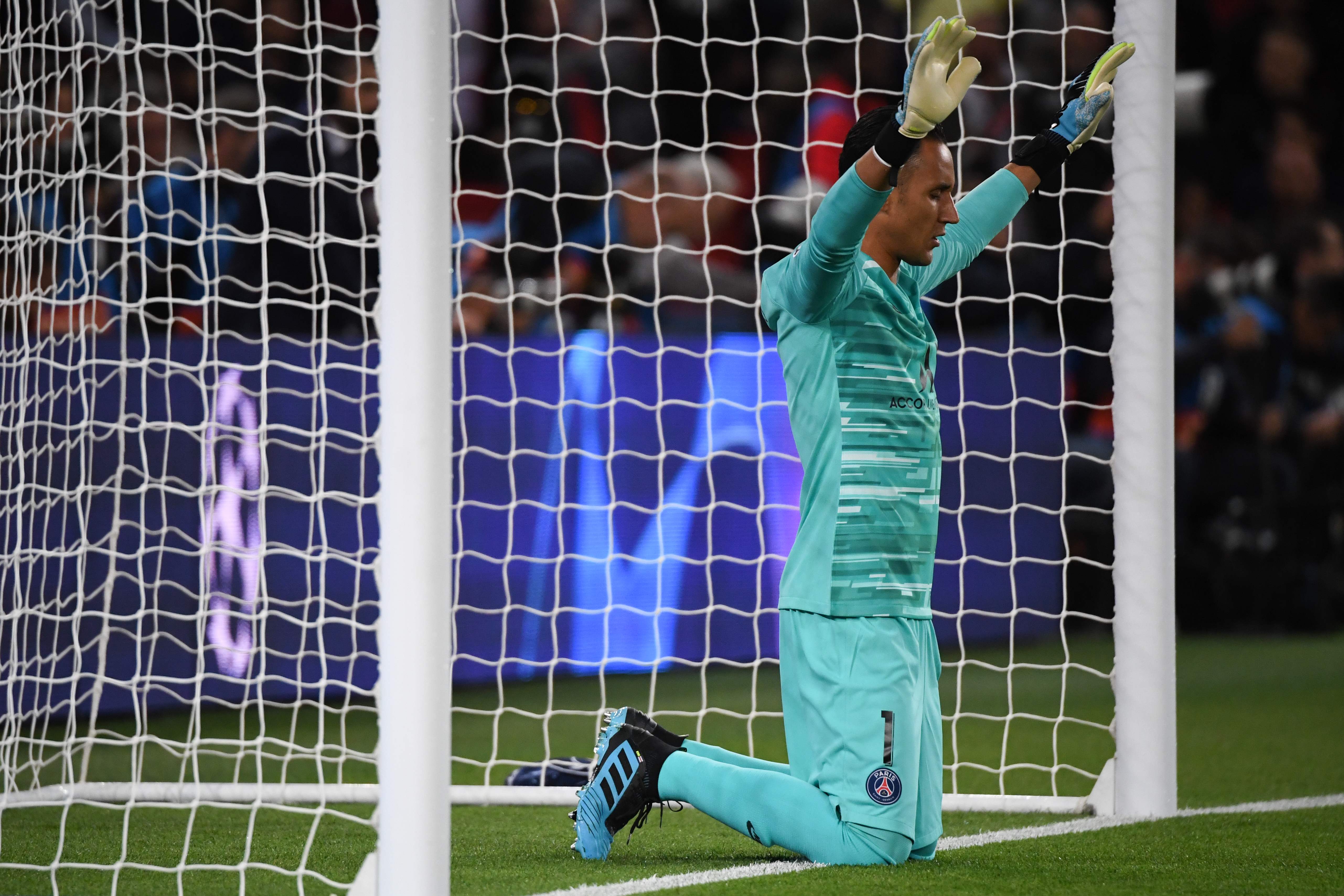 Paris Saint-Germain's Costa Rican Keylor Navas prays at the start of the UEFA Champions league Group A football match between Paris Saint-Germain and Real Madrid, at the Parc des Princes stadium, in Paris, on September 18, 2019. (Photo by MARTIN BUREAU / AFP)