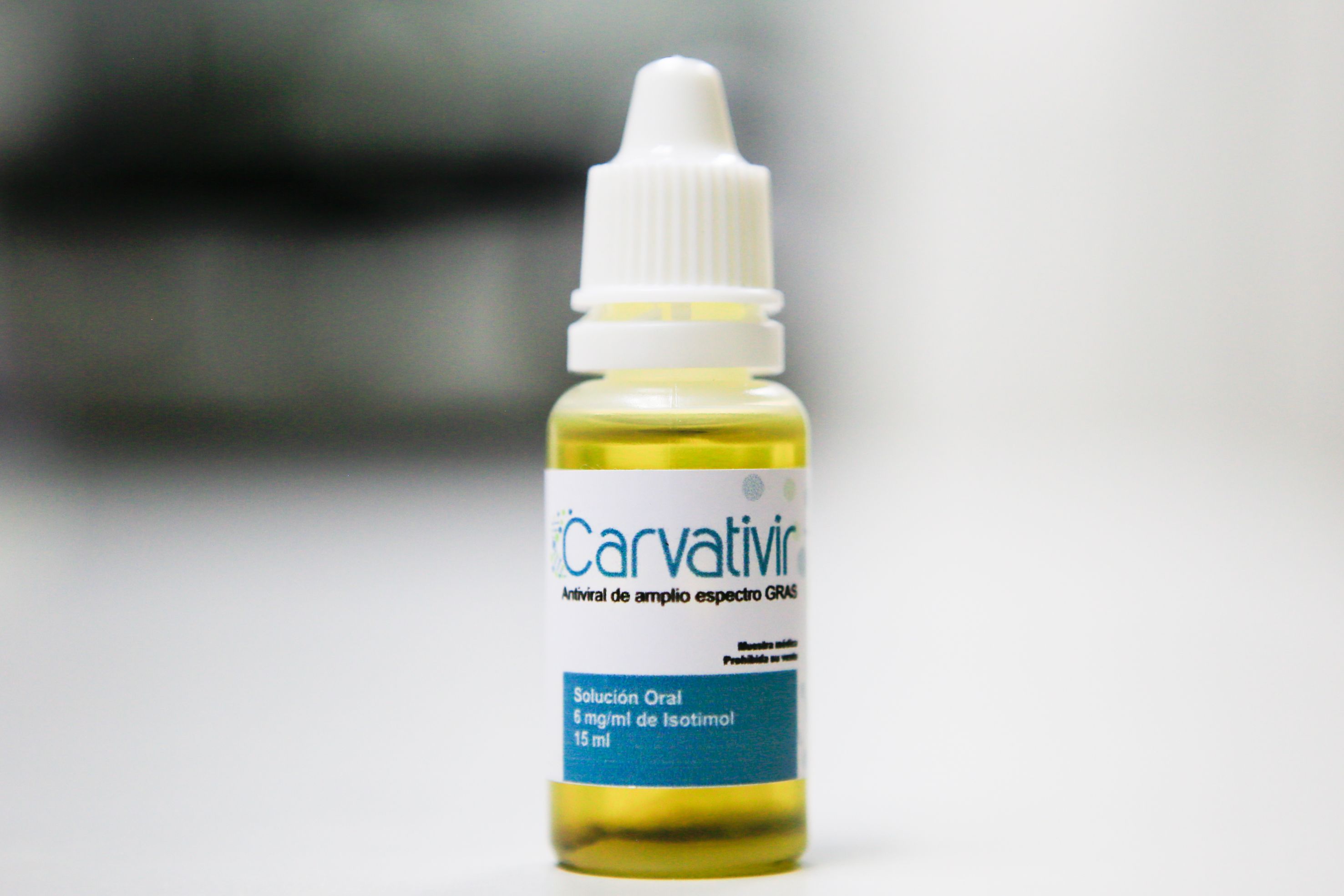Handout picture released by the Venezuelan Presidency showing a vial of Carvativir, during a televised message of Venezuela's President Nicolas Maduro (out frame) at Miraflores Presidential Palace in Caracas on January 24, 2021. - Carvativir is the latest in a series of remedies, without published medical studies allowing independent verification, that the socialist ruler has endorsed during the coronavirus pandemic, which has left more than two million people dead worldwide. (Photo by JHONN ZERPA / AFP)