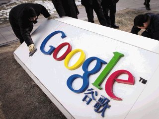 FILE - In this Jan. 25, 2010 file photo, workers clean and repair broken part of a marble tablet bearing Google's logo in front of Google China's headquarters building in Beijing. Google's future in China is in limbo and observers around the world are carefully tracking its dispute with Beijing. But one group is notably lukewarm on the fate of the Internet giant in the world's most populous online market: many of China's 384 million Internet users. (AP Photo/Alexander F. Yuan, File)