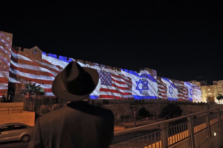 The Israeli and United States flags are projected on the walls of the ramparts of Jerusalem's Old City, to mark the opening of the new US embassy on May 14, 2018.
The United States moved its embassy in Israel to Jerusalem after months of global outcry, Palestinian anger and exuberant praise from Israelis over President Donald Trump's decision tossing aside decades of precedent. / AFP PHOTO / Ahmad GHARABLI