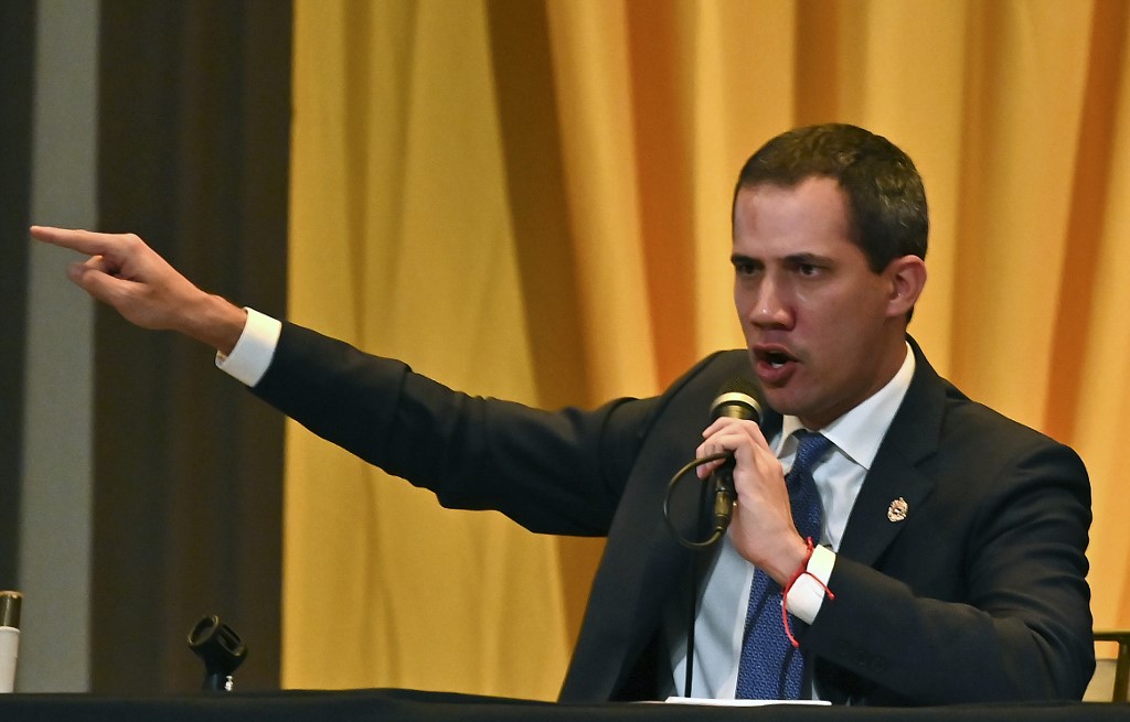 Venezuelan opposition leader Juan Guaido speaks during a plenary session of the National Assembly at the Maria Auxiliadora College auditorium, in Caracas, on March 4, 2020. (Photo by Federico PARRA / AFP)