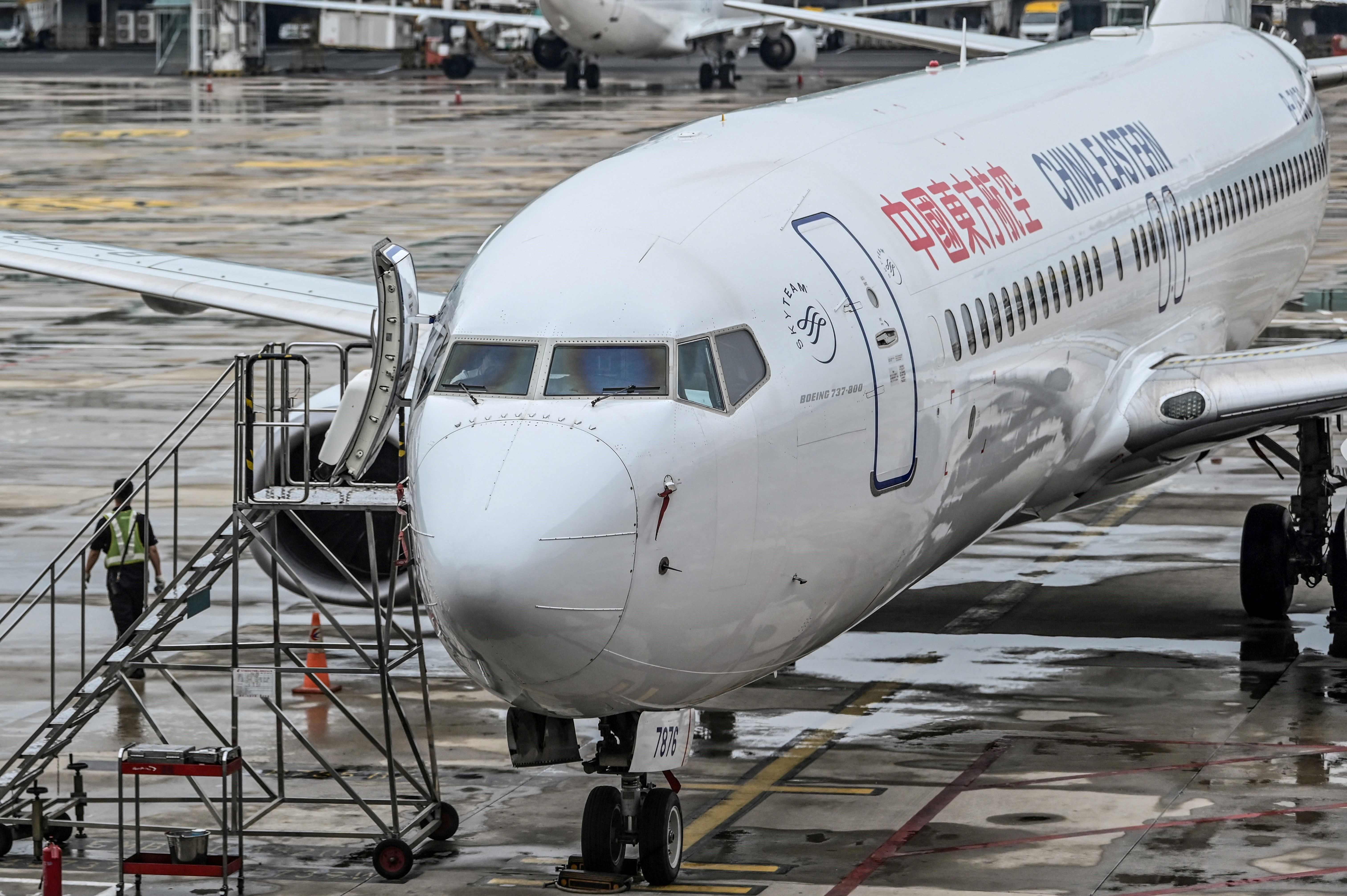 (FILES) This file photo taken on May 29, 2020 shows a China Eastern Airlines Boeing 737-800 aircraft parked at the Tianhe Airport in Wuhan, China�s central Hubei province. - A China Eastern passenger jet carrying at least 132 people has "crashed" in southwest China, the state flight regulator confirmed on March 21, 2022, with the number of casualties unknown according to the country's state broadcaster. (Photo by Hector RETAMAL / AFP)