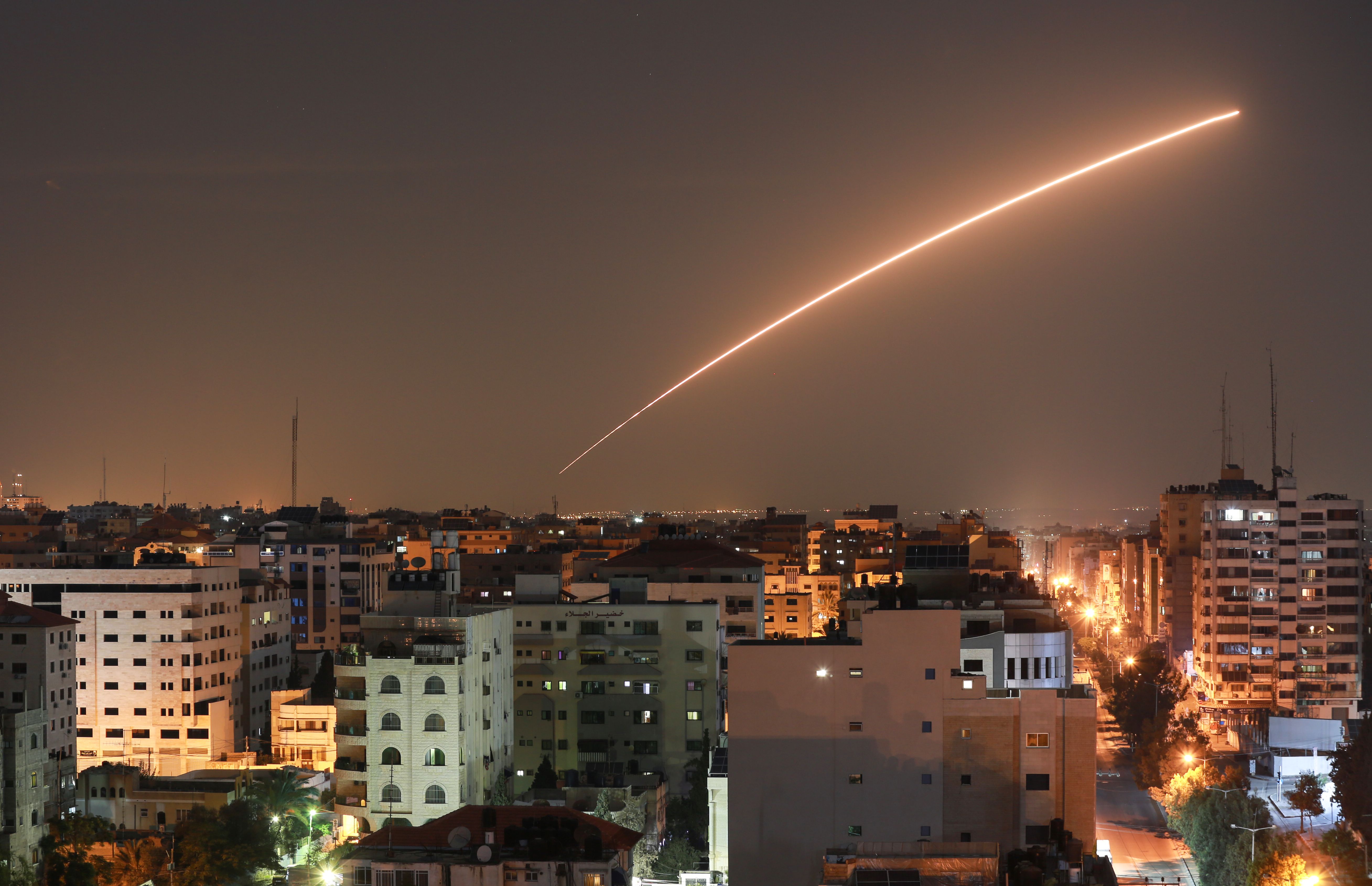 TOPSHOT - Israeli missile launched from the Iron Dome defence missile system, designed to intercept and destroy incoming short-range rockets and artillery shells, is seen above Gaza city on November 12, 2019. (Photo by BASHAR TALEB / AFP)