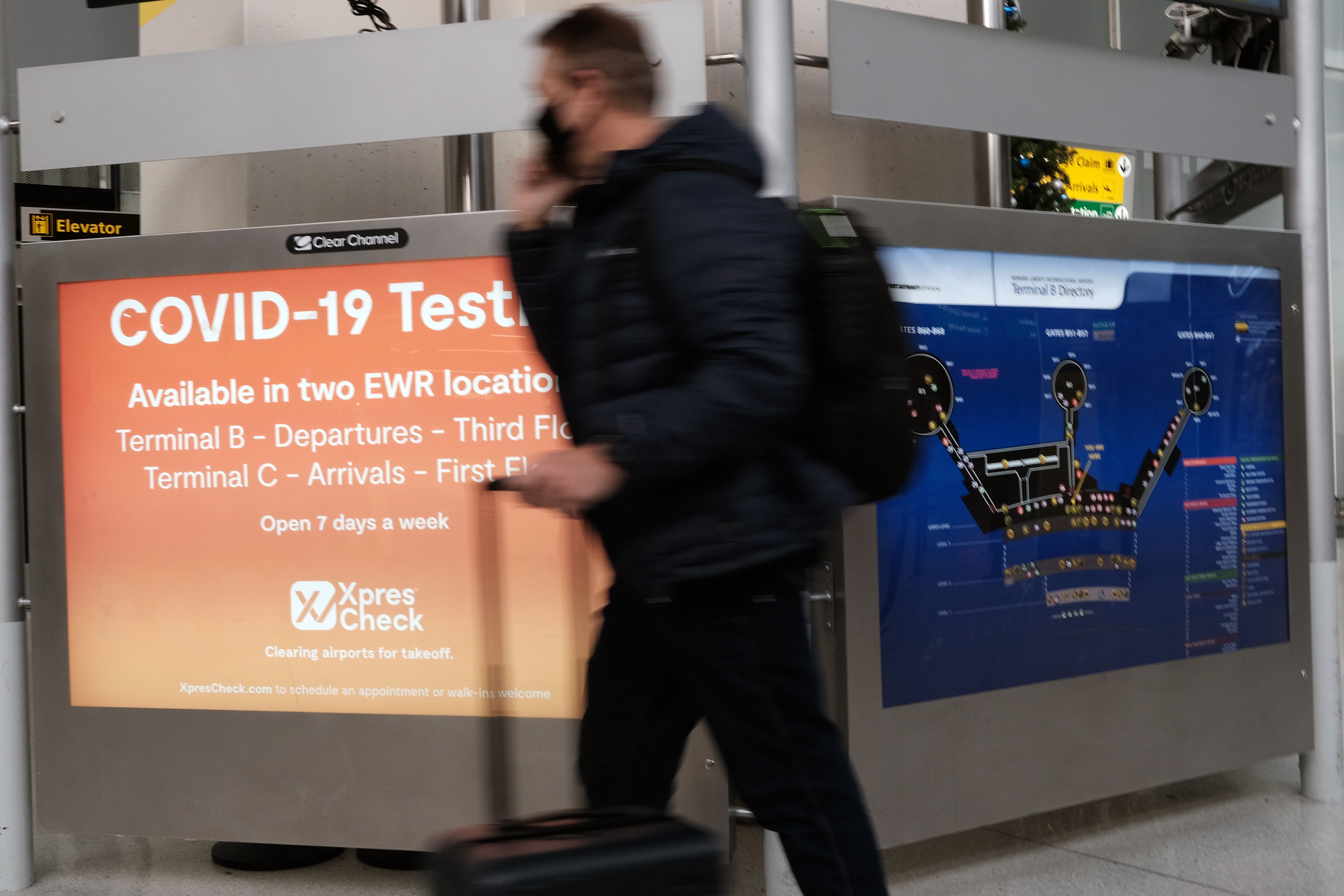 NEWARK, NEW JERSEY - NOVEMBER 30: A COVID-19 testing facility is advertised at Newark Liberty International Airport on November 30, 2021 in Newark, New Jersey. The United States, and a growing list of other countries, has restricted flights from southern African countries due to the detection of the COVID-19 Omicron variant last week in South Africa. Stocks in the travel and airline industry have fallen in recent days as fears grow over the spread and severity of the variant. Spencer Platt/Getty Images/AFP
== FOR NEWSPAPERS, INTERNET, TELCOS & TELEVISION USE ONLY ==