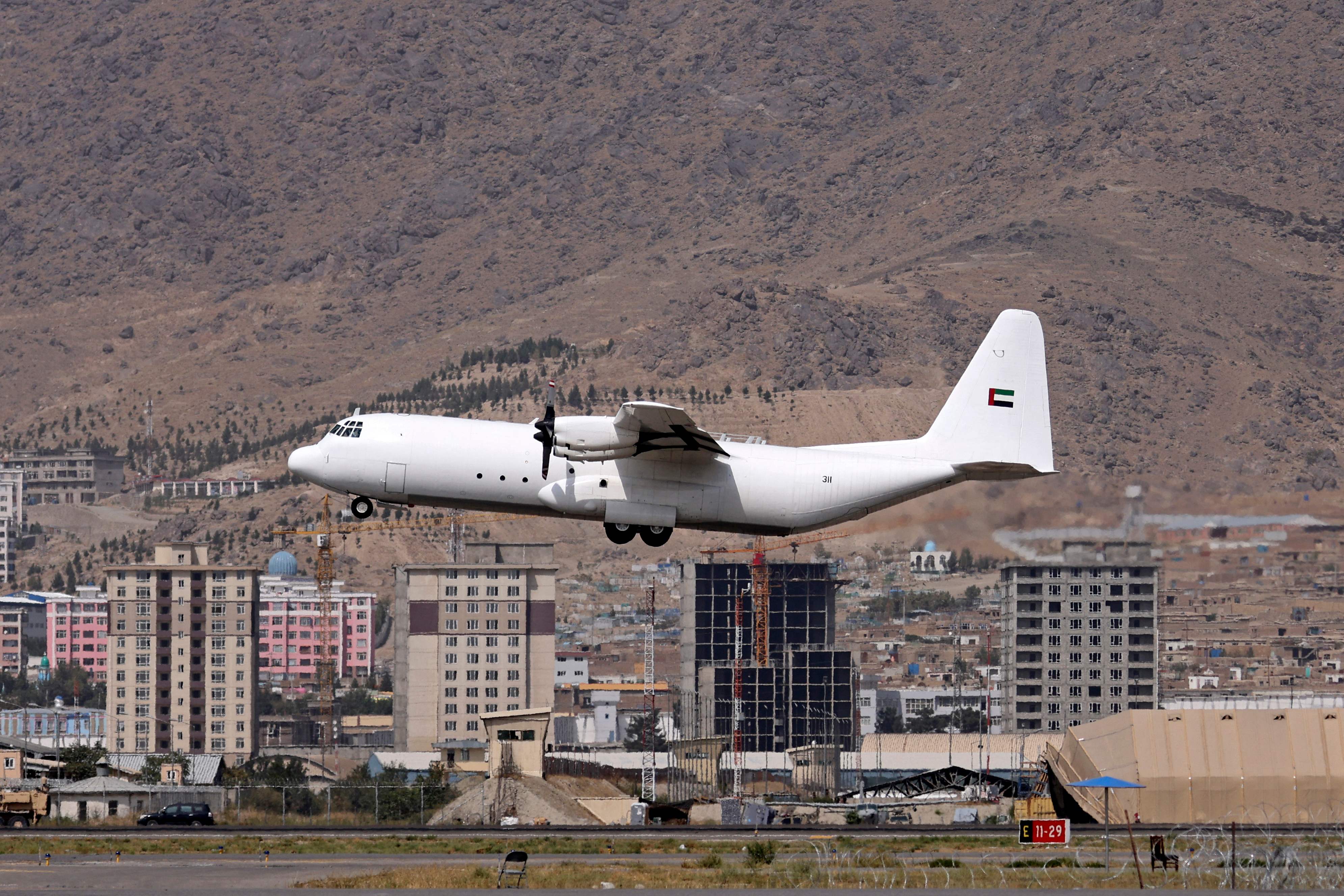 An aircraft carrying humanitarian aid from the United Arab Emirates prepares to land at the airport in Kabul on September 12, 2021. (Photo by Karim SAHIB / AFP)