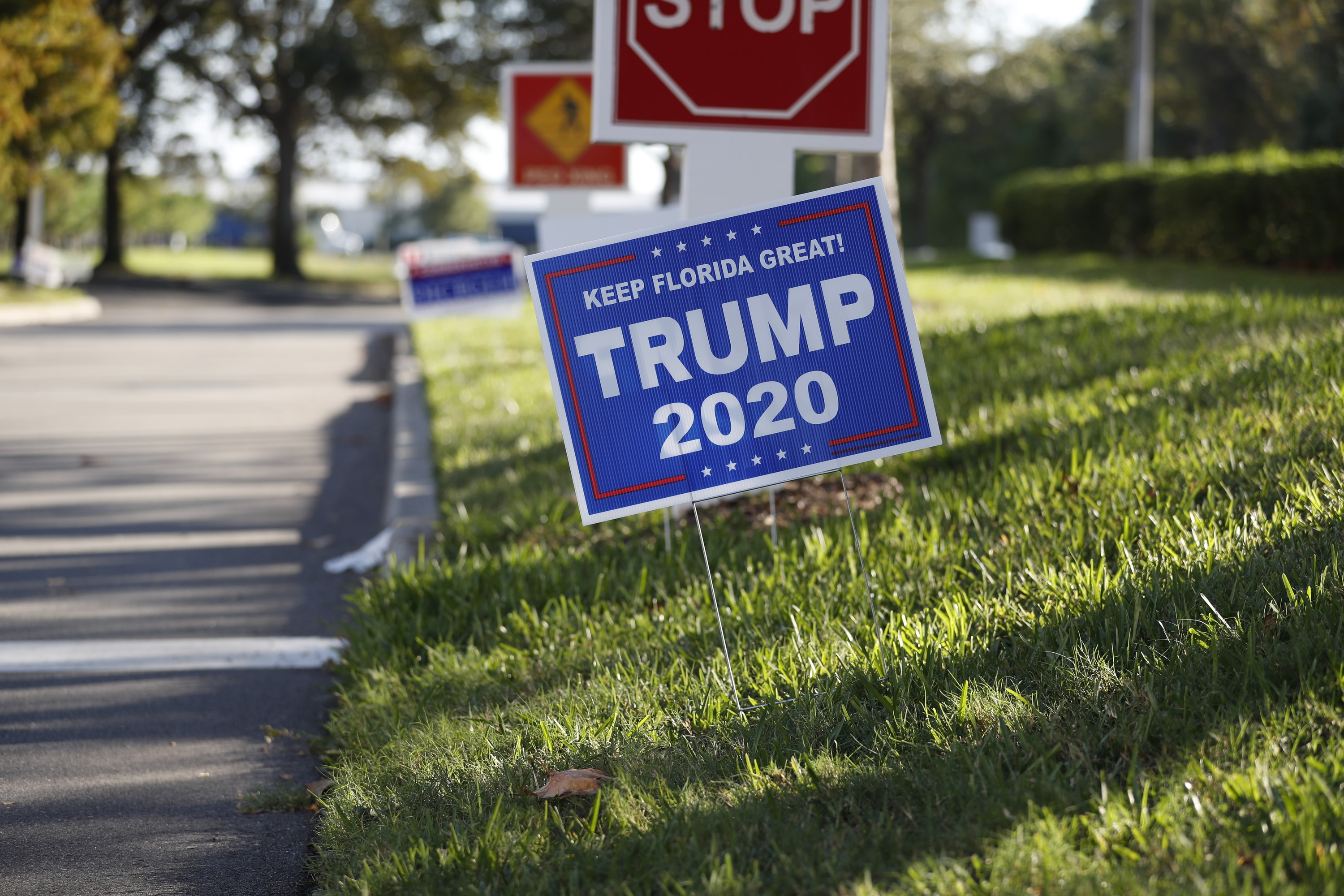 LARGO, FL - OCTOBER 25: A Trump 2020 campaign sign is displayed near the Pinellas County Supervisor of Elections office polling station on October 25, 2020 in Largo, Florida. The Pinellas County Sheriff's Office stated they would station deputies outside five polling locations after armed security guards were seen at a polling site last week. Octavio Jones/Getty Images/AFP
== FOR NEWSPAPERS, INTERNET, TELCOS & TELEVISION USE ONLY ==