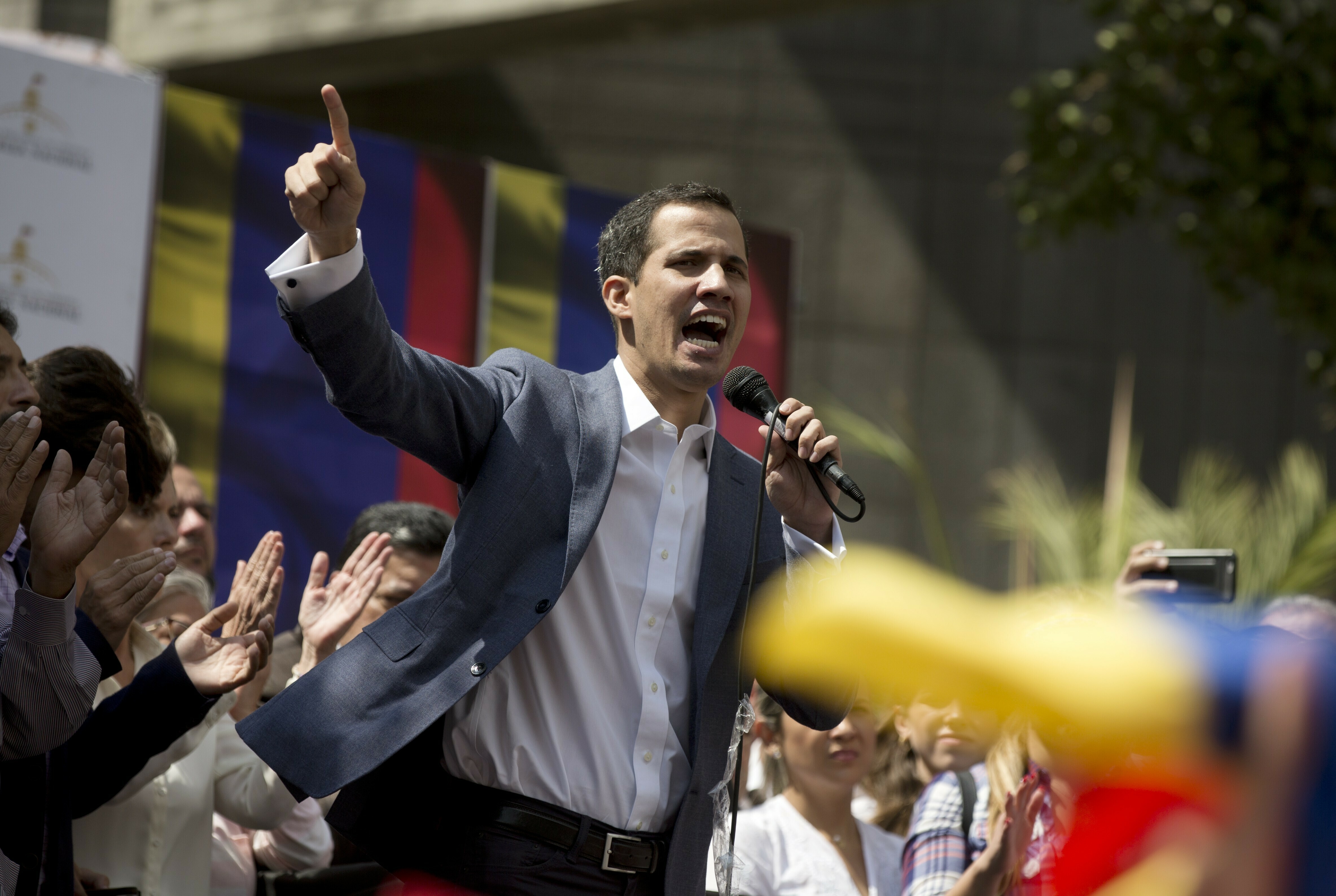 Juan Guaido, President of the Venezuelan National Assembly delivers a speech during a public session with opposition members, at a street in Caracas, Venezuela, Friday, Jan. 11, 2019. The head of Venezuela's opposition-run congress says that with the nation's backing he's ready to take on Nicolas Maduro's presidential powers and call new elections.(AP Photo/Fernando Llano)