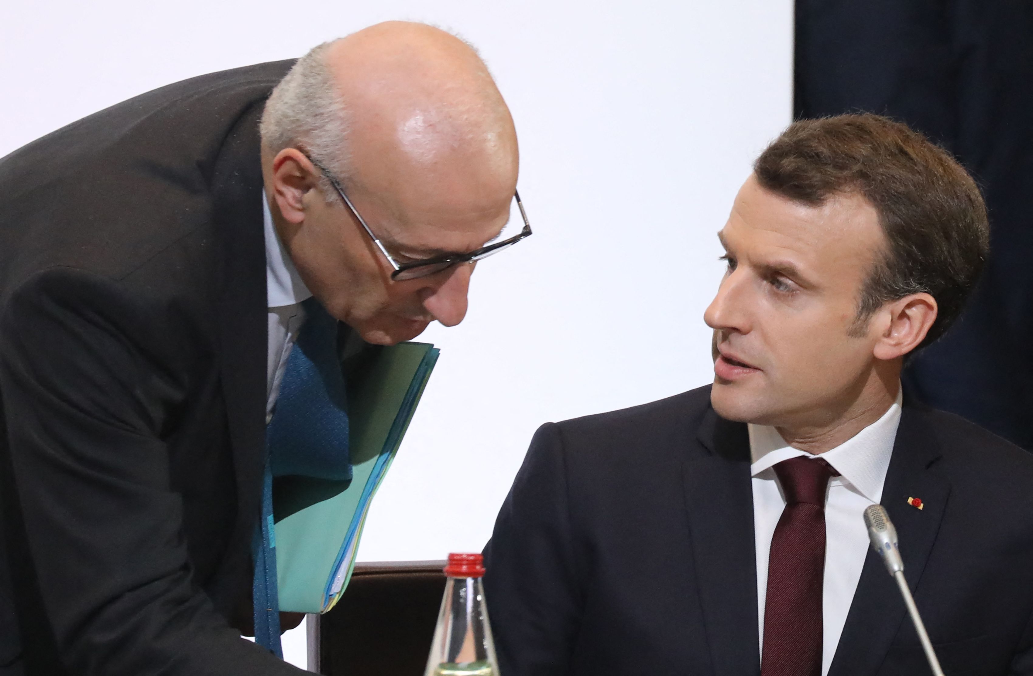 (FILES) In this file photo taken on April 6, 2018 French President Emmanuel Macron (R) speaks with presidential diplomatic advisor Philippe Etienne as they take part in the Cedre conference at The Foreign Affairs Ministry in Paris. - France on September 17, 2021 recalled its ambassadors to the United States, Philippe Etienne, and Australia, Jean-Pierre Thebault, for consultations in a ferocious row over the scrapping of a submarine contract, an unprecedented step that revealed the extent of French anger against its allies. (Photo by Ludovic MARIN / POOL / AFP)