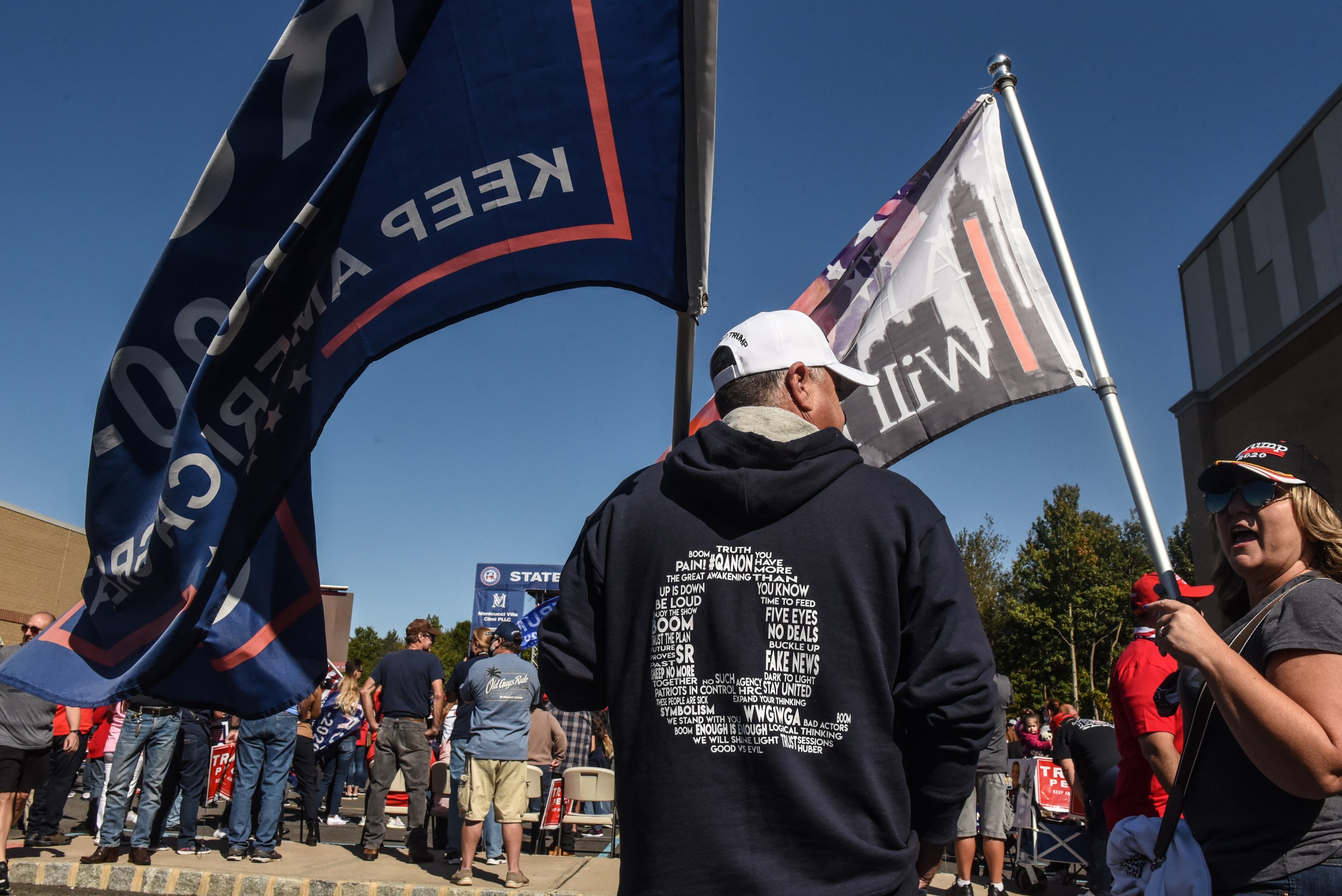 NEW YORK, NY - OCTOBER 03: A person wears a QAnon sweatshirt during a pro-Trump rally on October 3, 2020 in the borough of Staten Island in New York City. The event, which was organized weeks ago, encouraged people to vote Republican and to pray for the health of President Trump who fell ill with Covid-19. Stephanie Keith/Getty Images/AFP
== FOR NEWSPAPERS, INTERNET, TELCOS & TELEVISION USE ONLY ==