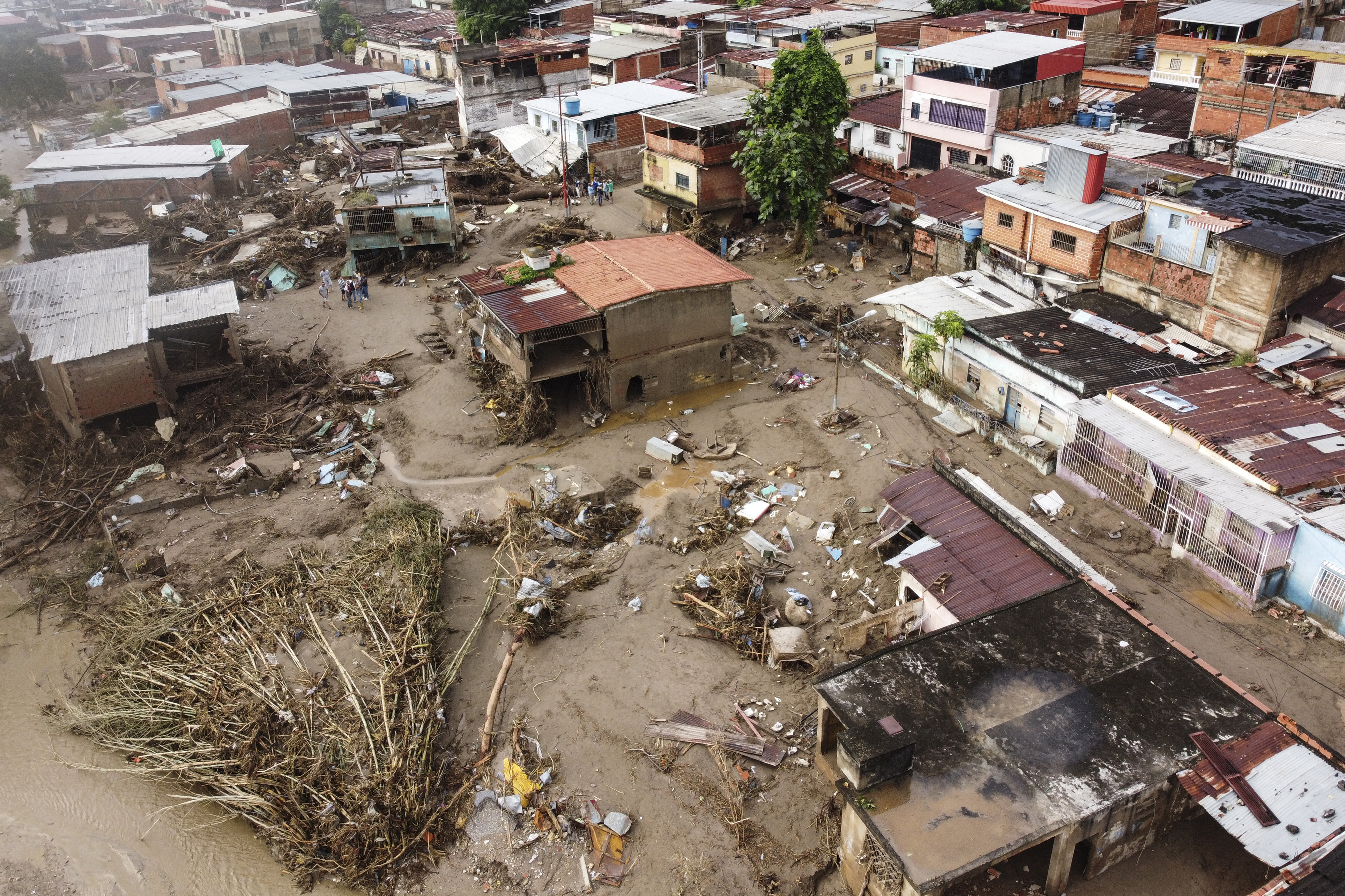 Aerial view of the zone affected by a landslide during heavy rains in Las Tejerias, Aragua state, Venezuela, on October 10, 2022. - A landslide in central Venezuela left at least 22 people dead and more than 50 missing after heavy rains caused a river to overflow, Vice President Delcy Rodriguez said Sunday. (Photo by Yuri CORTEZ / AFP)