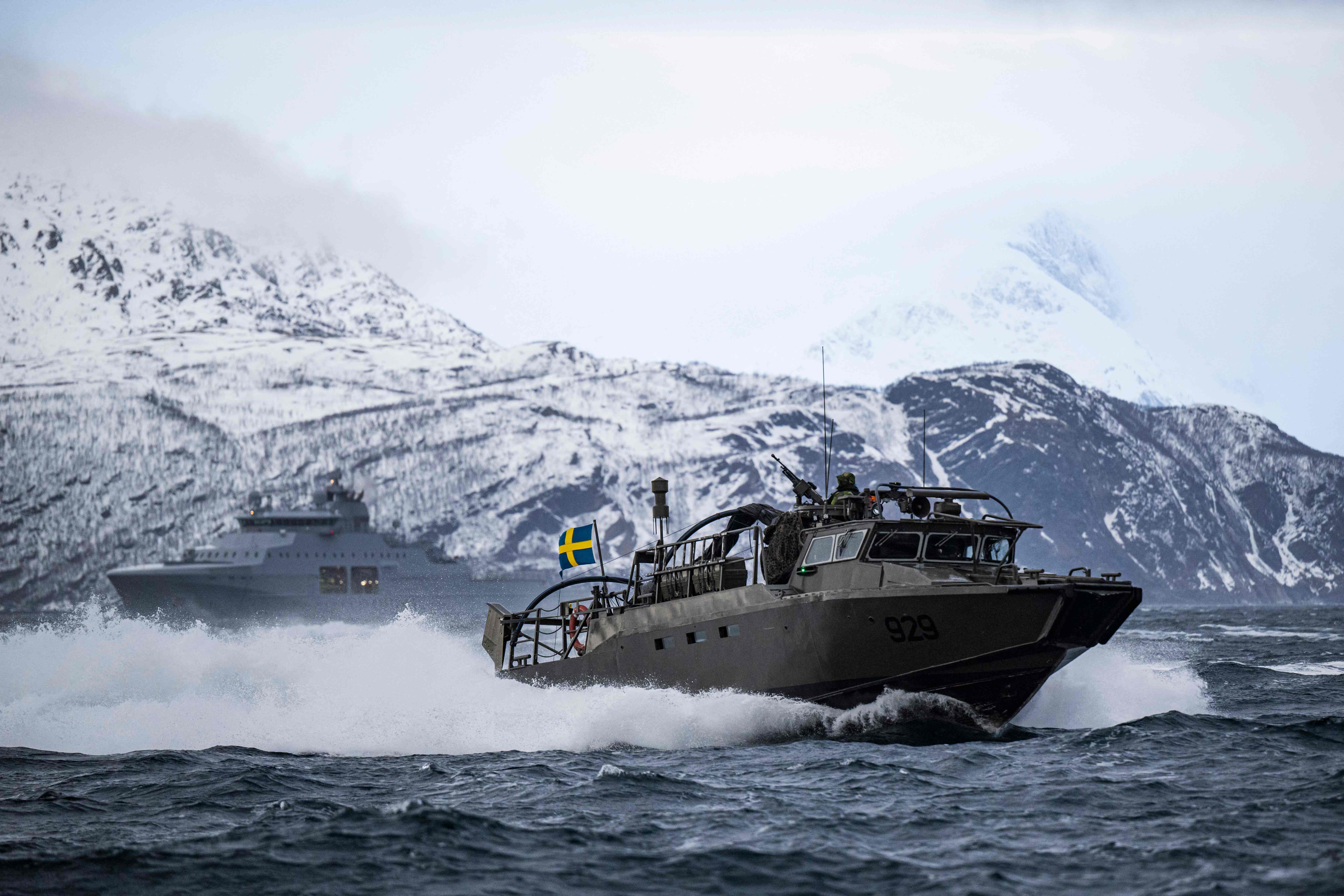 Swedish CB90-class fast assault craft in action during the Nordic Response 24 military exercise on March 10, 2024, at sea near Sorstraumen, above the Arctic Circle in Norway. Nordic Response 24 is part of the larger NATO exercise Steadfast Defender. The exercise involves air, sea, and land forces, with over 100 fighter jets, 50 ships, and over 20,000 troops practicing defensive manoeuvres in cold and harsh weather conditions. (Photo by Jonathan NACKSTRAND / AFP)
