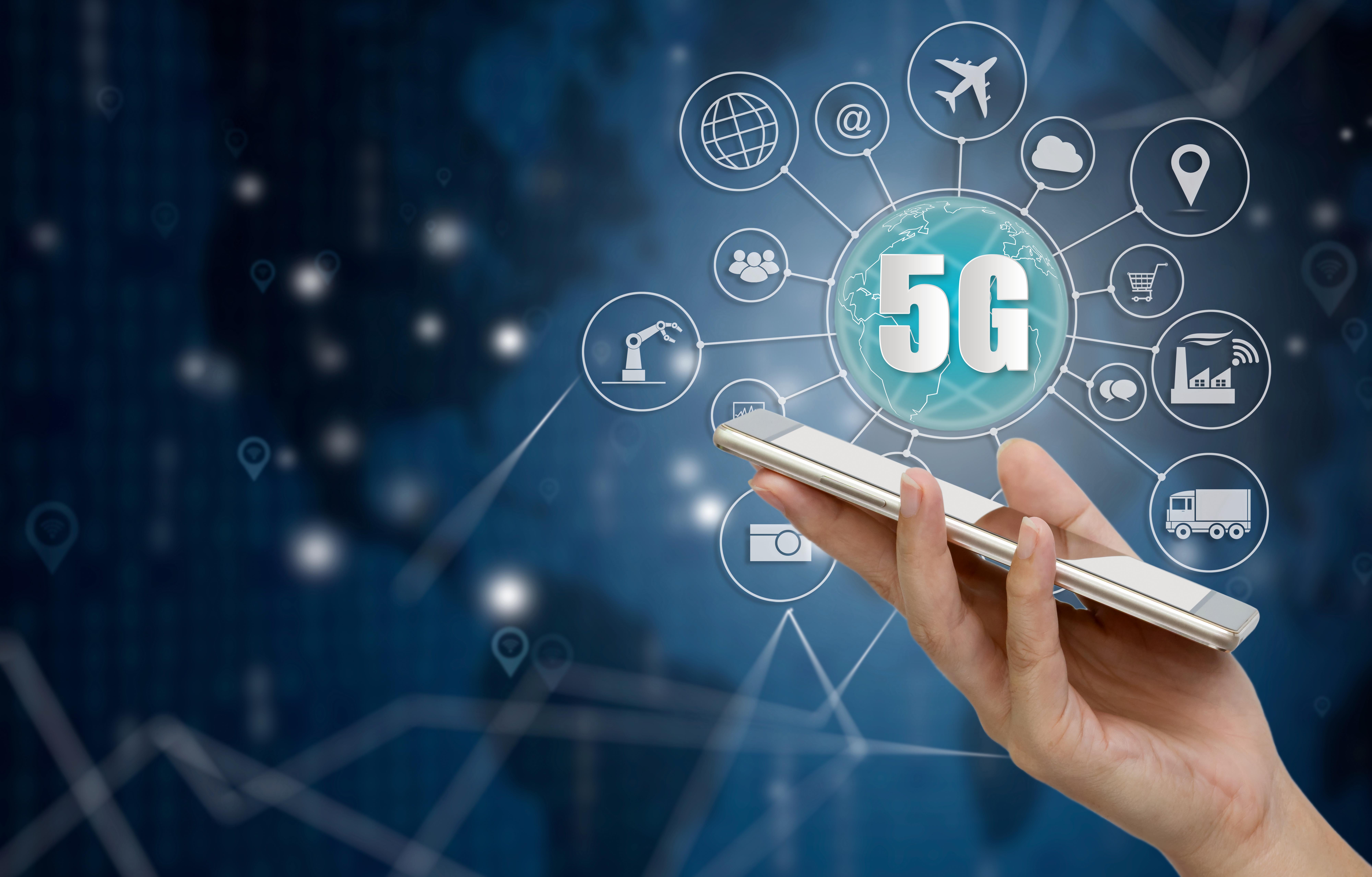 5G network wireless systems and internet of things, Smart city and communication network with smartphone in hand and objects icon connecting together, Connect global wireless devices.